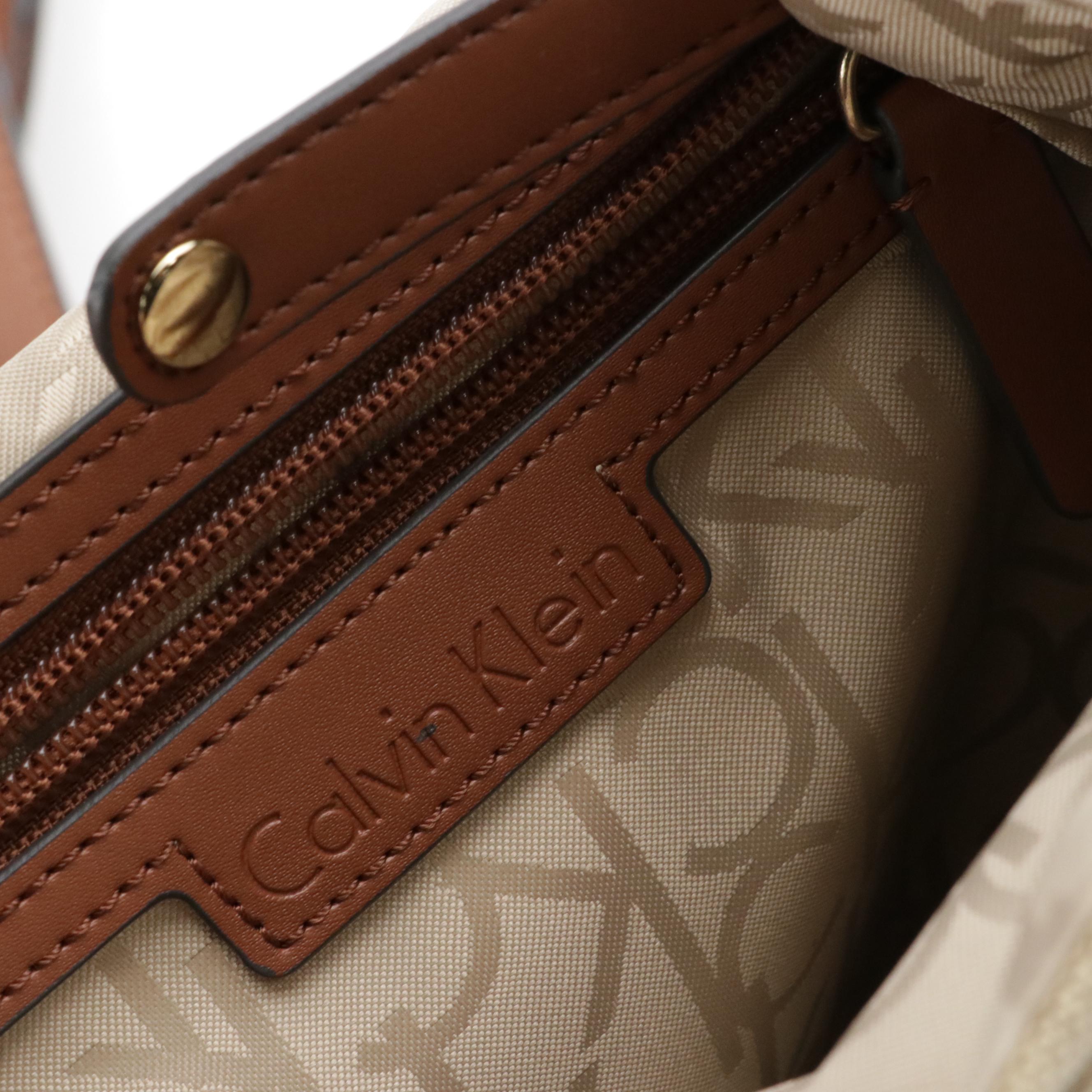 Dooney & Bourke Cooper Hobo Shoulder Bag & Calvin Klein Teodora Canvas Backpack