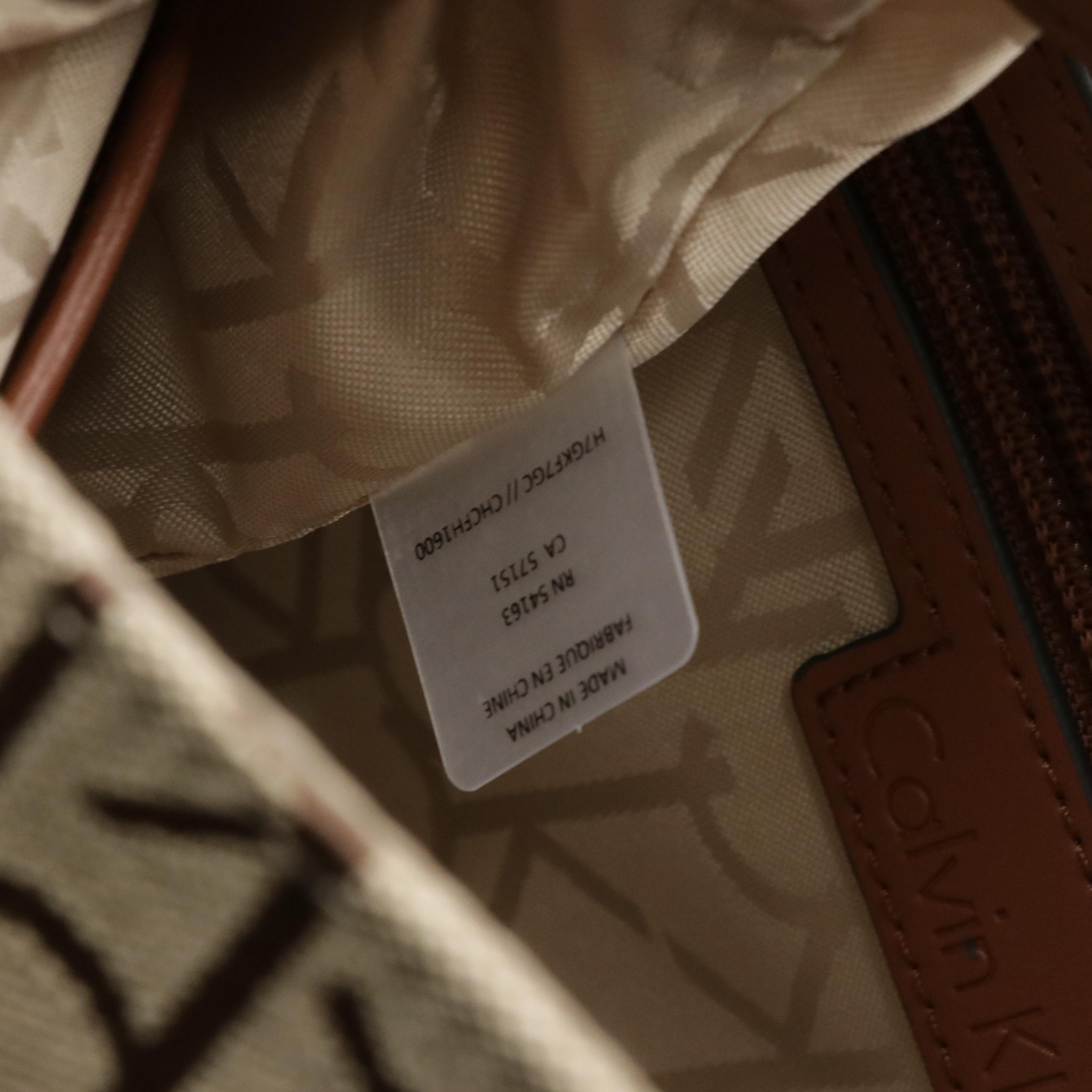 Dooney & Bourke Cooper Hobo Shoulder Bag & Calvin Klein Teodora Canvas Backpack