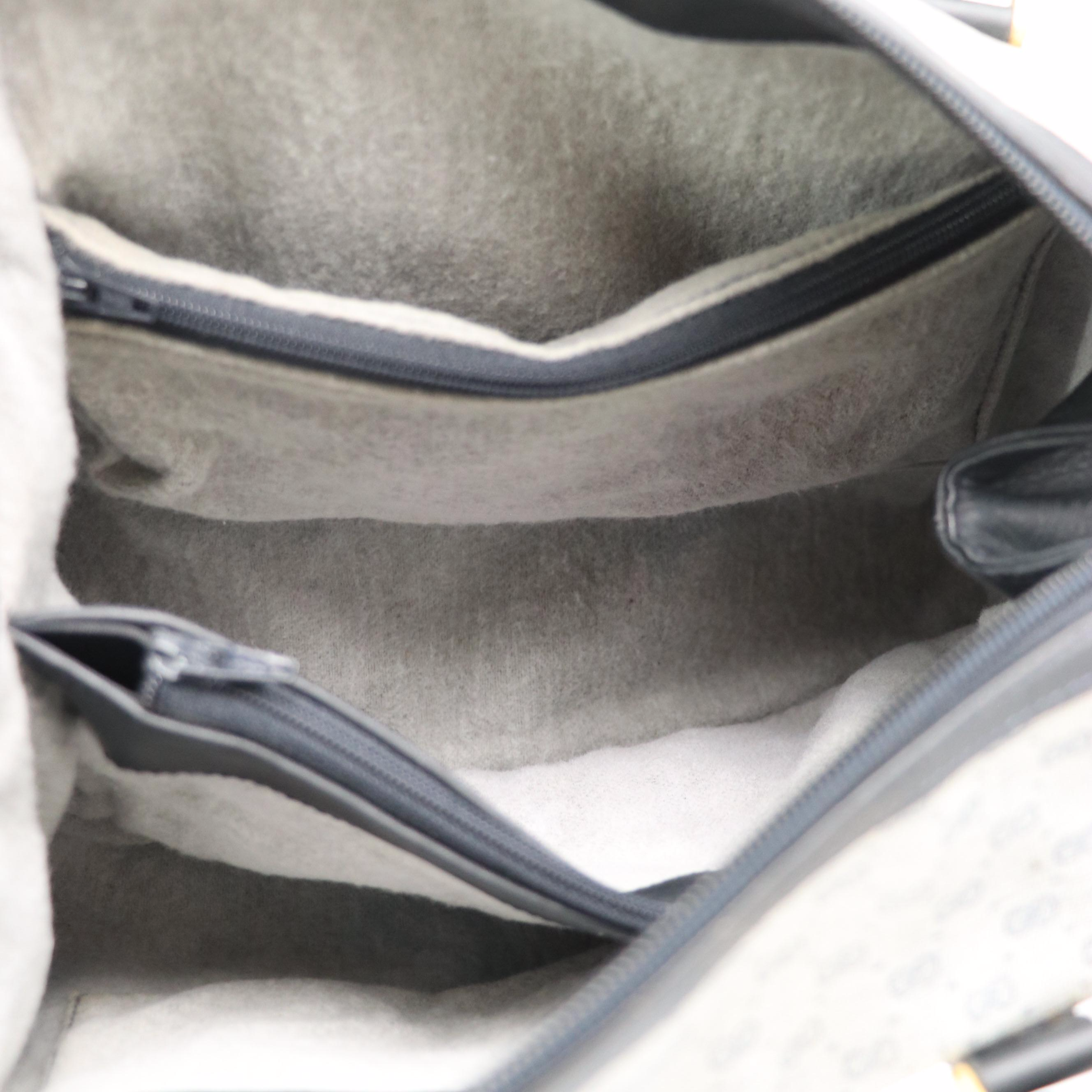 Gucci Interlocking GG Boston Bag in Micro GG Supreme Canvas and Navy Leather