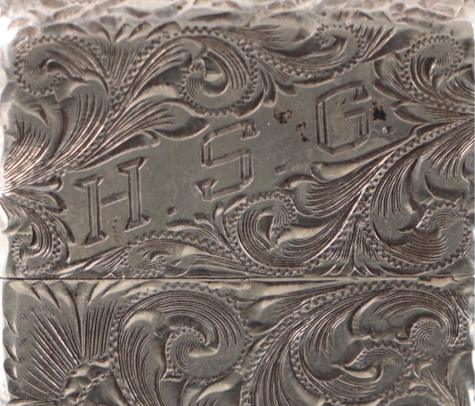 Zippo Sterling Silver Chased Lighter, 20th Century