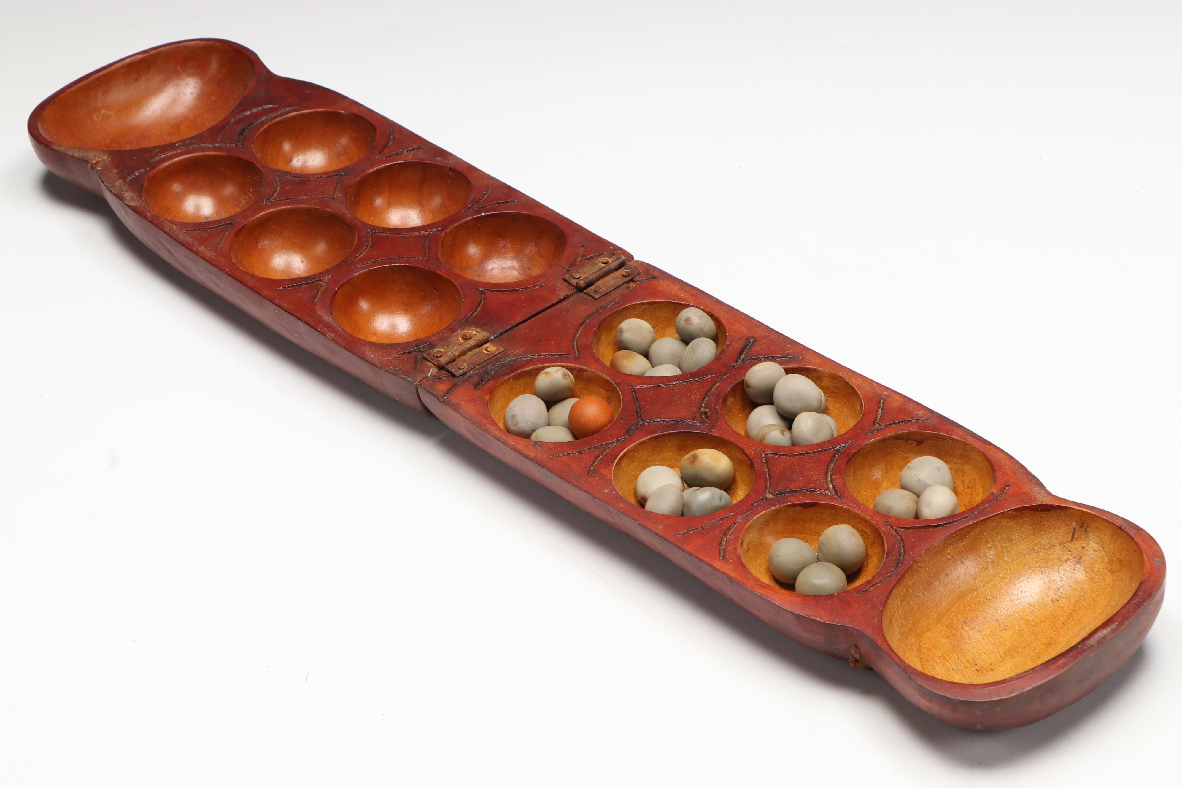 Wood Mancala Board with Seed Game Pieces with Carved Wood Post and Vessel