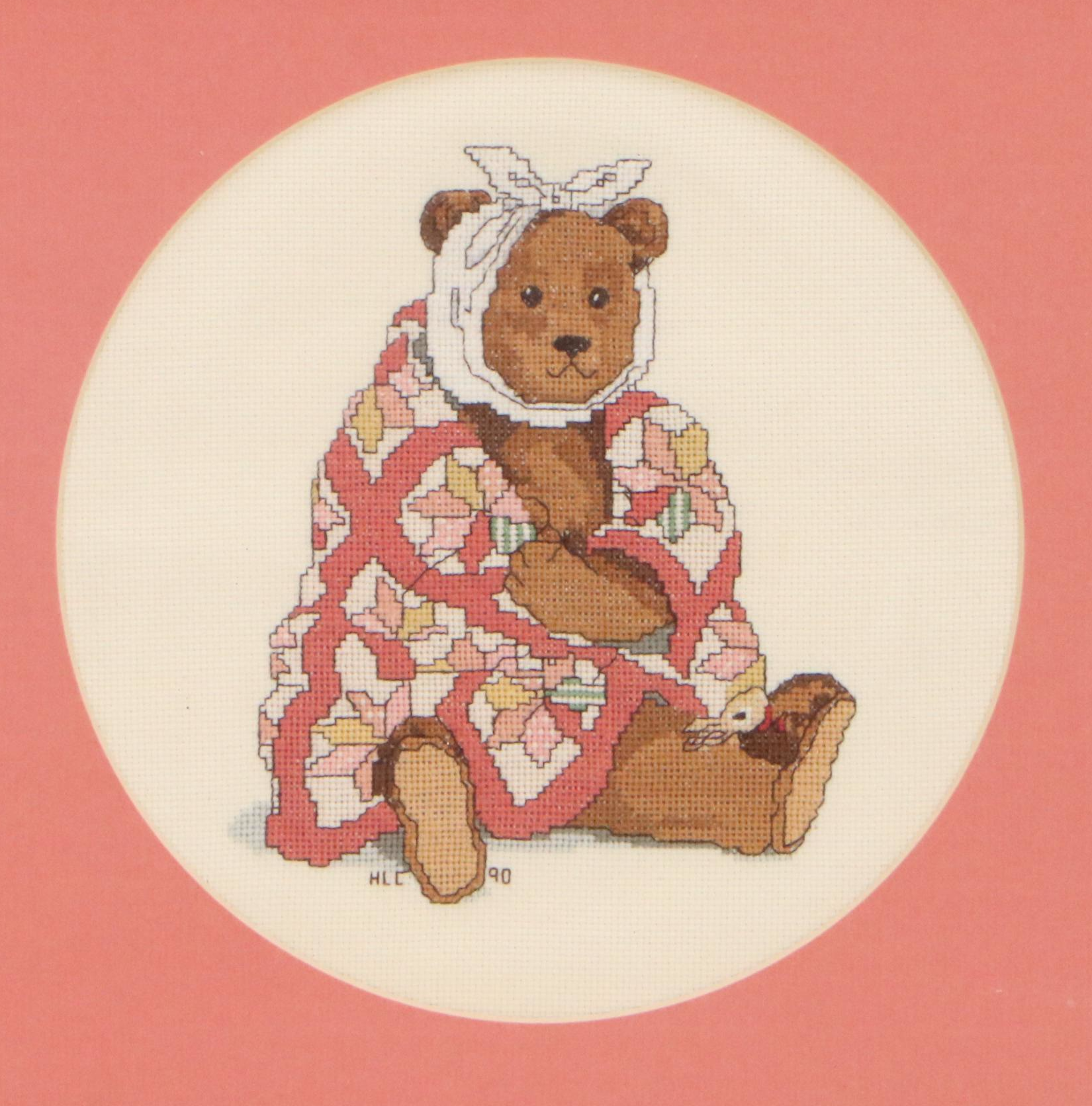 Cross-Stitch of Seated Teddy Bear with Quilt and Headwrap, 1990