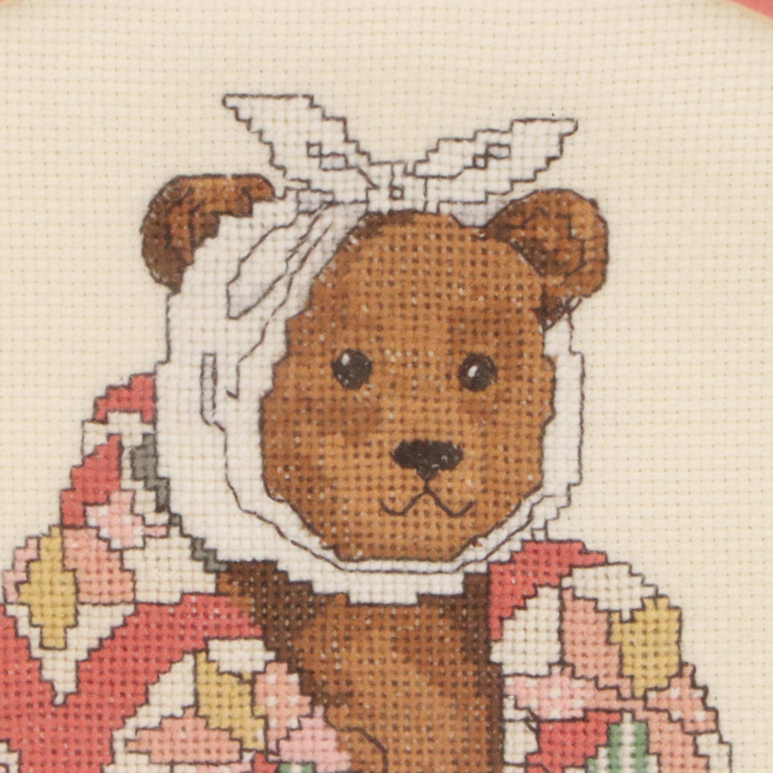 Cross-Stitch of Seated Teddy Bear with Quilt and Headwrap, 1990