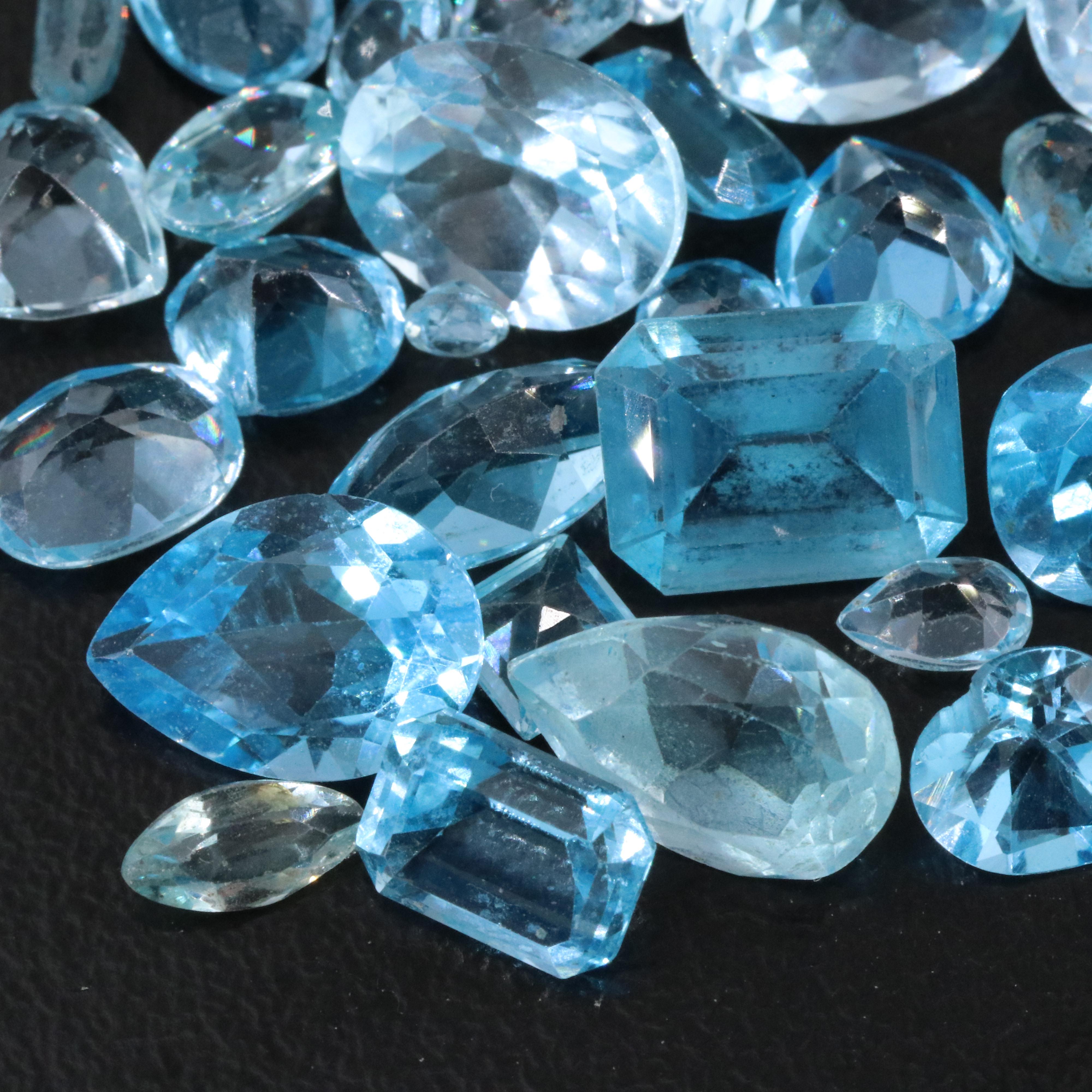 Loose 44.93 CTW Gemstone Lot Including Topaz, Aquamarine and Lab Grown Spinel