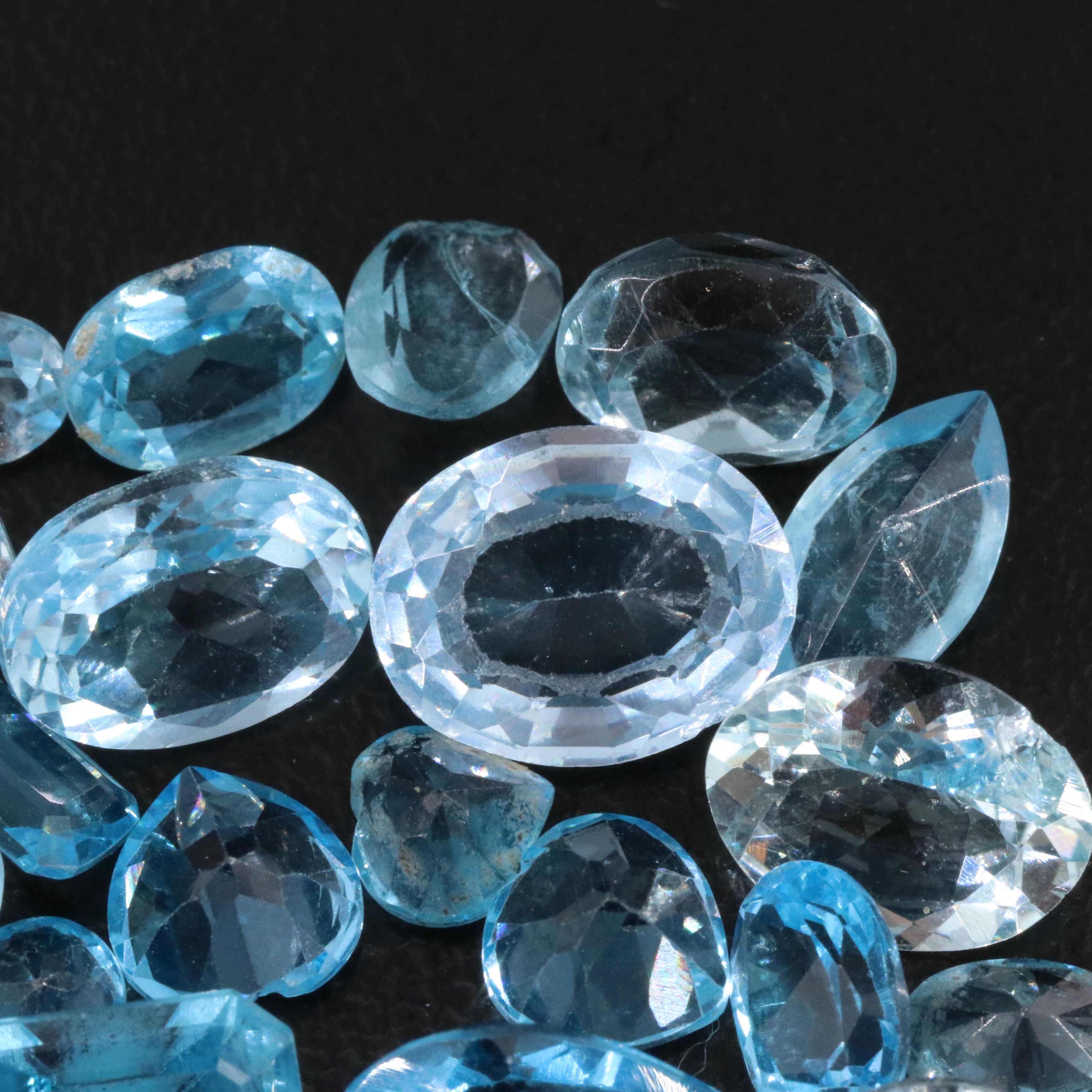 Loose 44.93 CTW Gemstone Lot Including Topaz, Aquamarine and Lab Grown Spinel