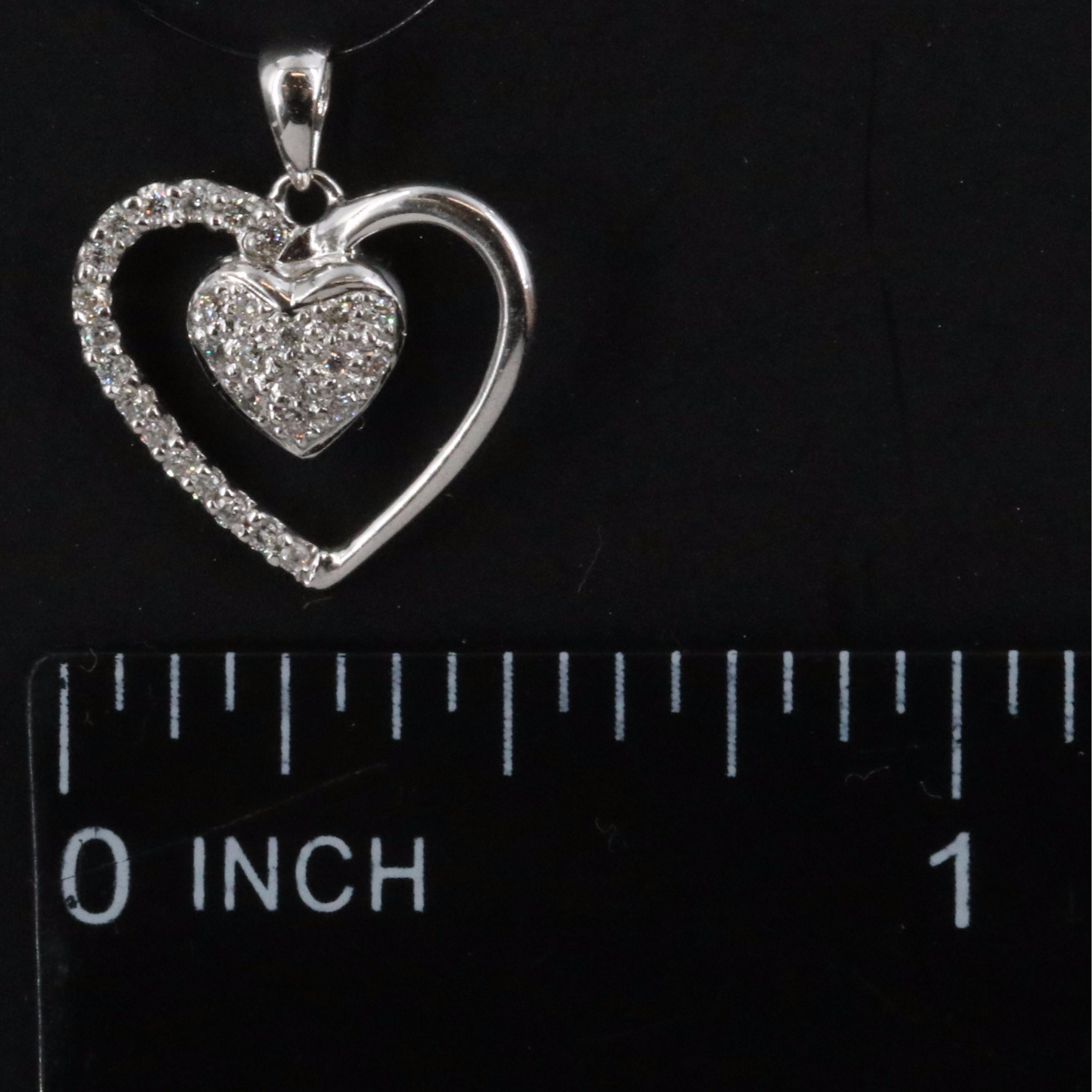 18K 0.09 CTW Diamond Heart Pendant