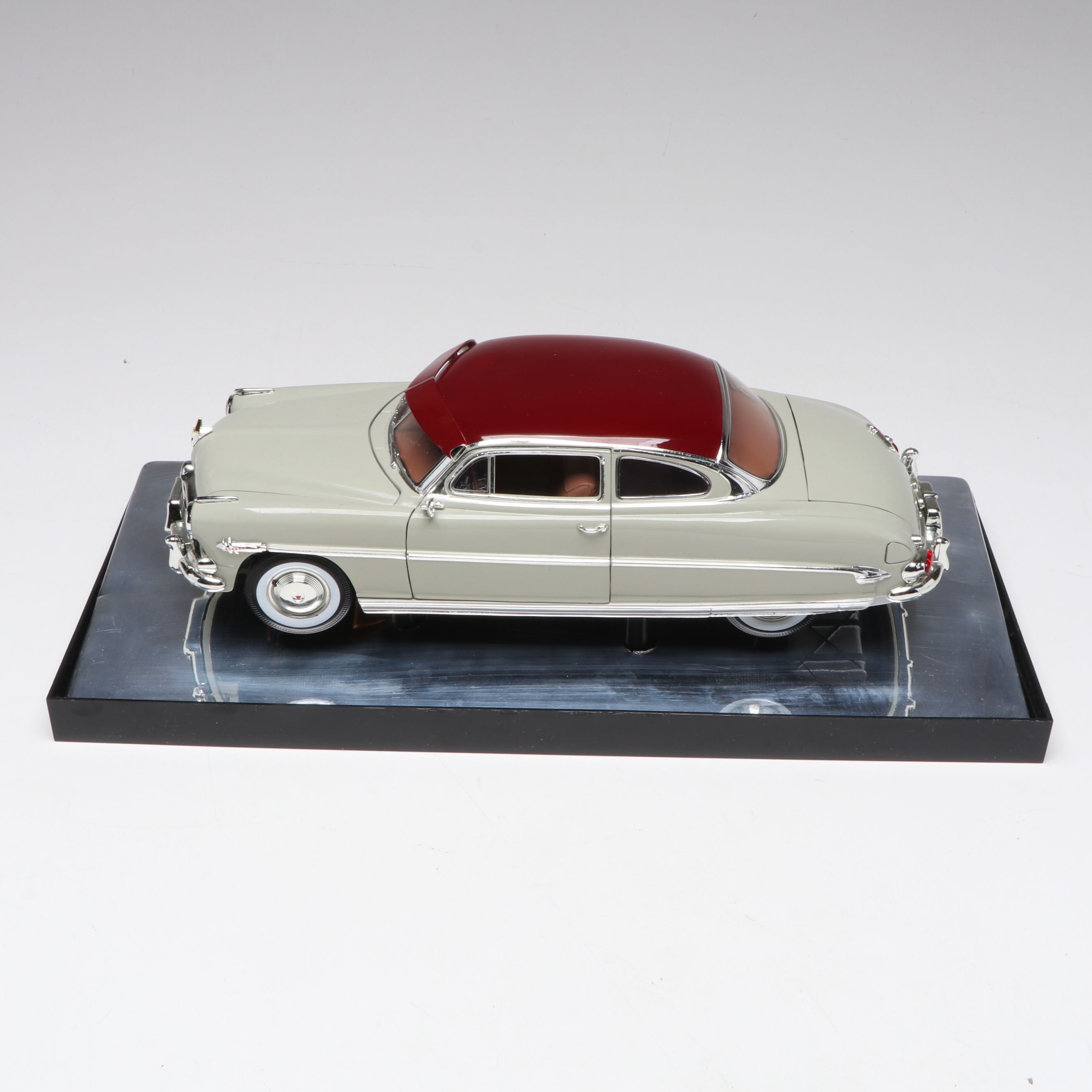 1957 Studebaker Gold Hawk with More Scale Model Diecast Cars and Stands