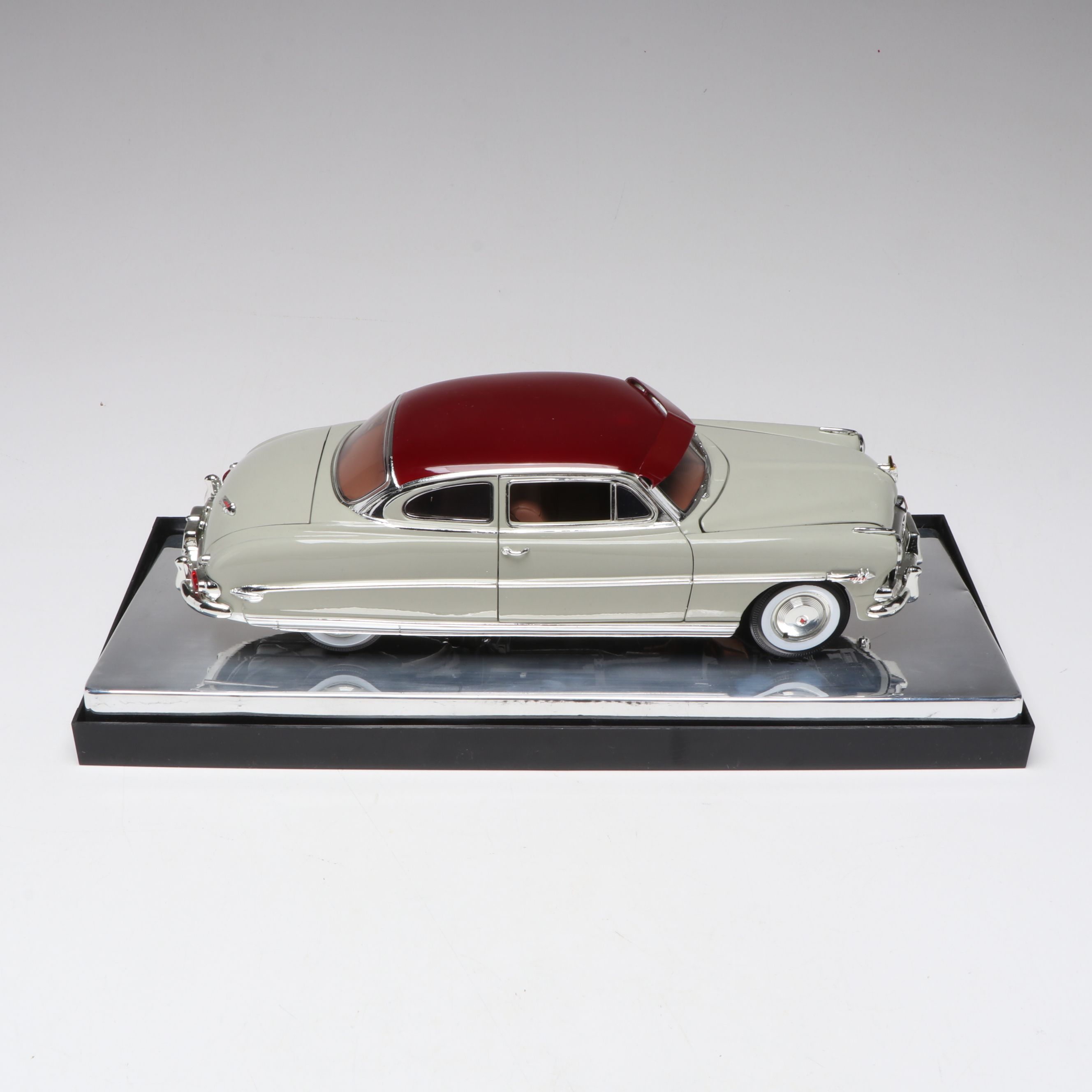 1957 Studebaker Gold Hawk with More Scale Model Diecast Cars and Stands