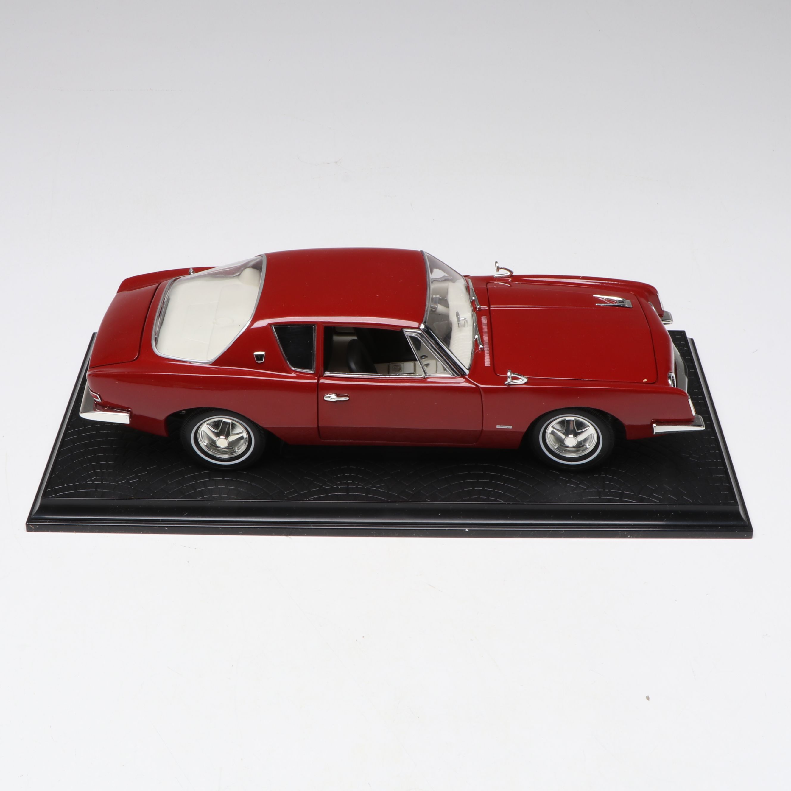 1957 Studebaker Gold Hawk with More Scale Model Diecast Cars and Stands
