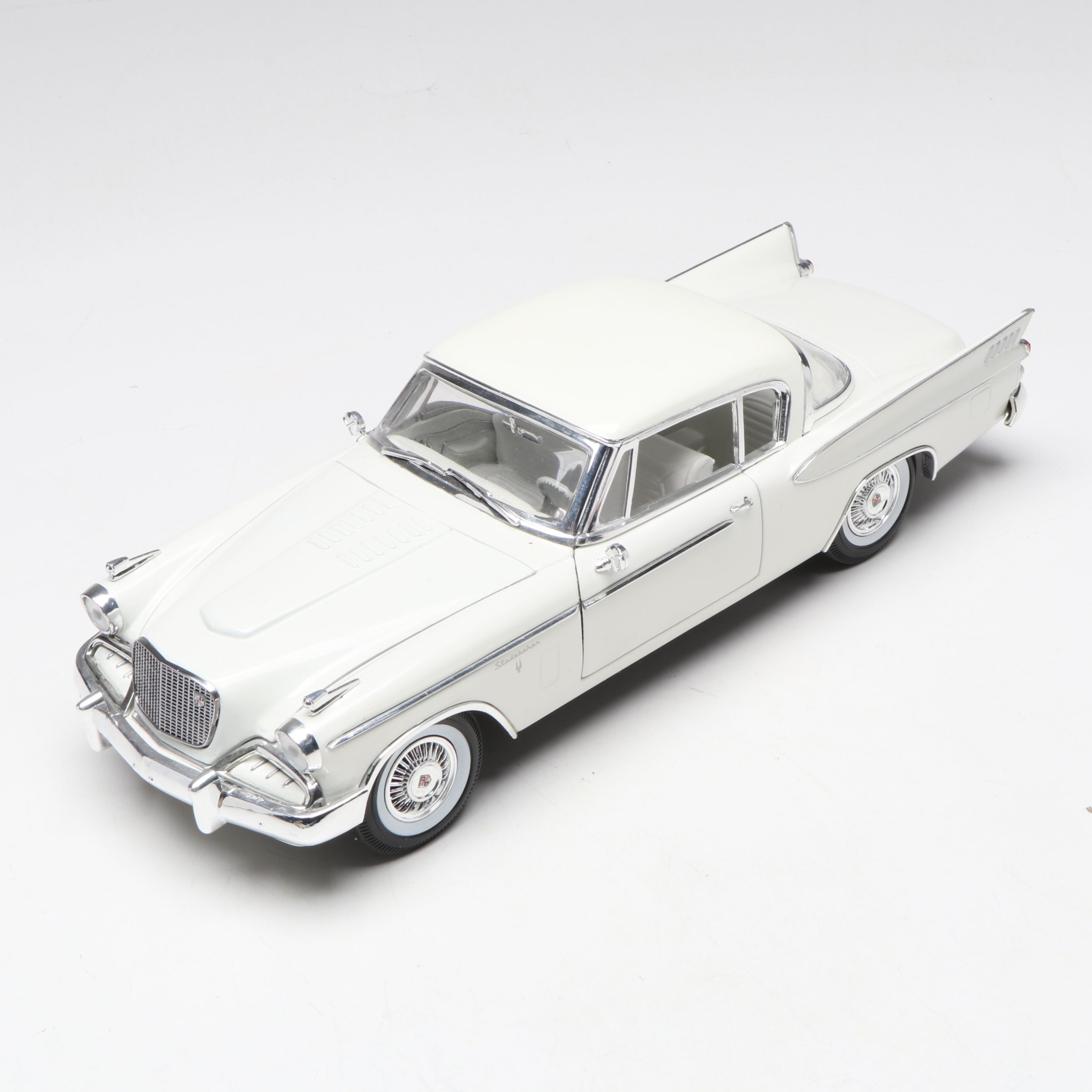 1957 Studebaker Gold Hawk with More Scale Model Diecast Cars and Stands