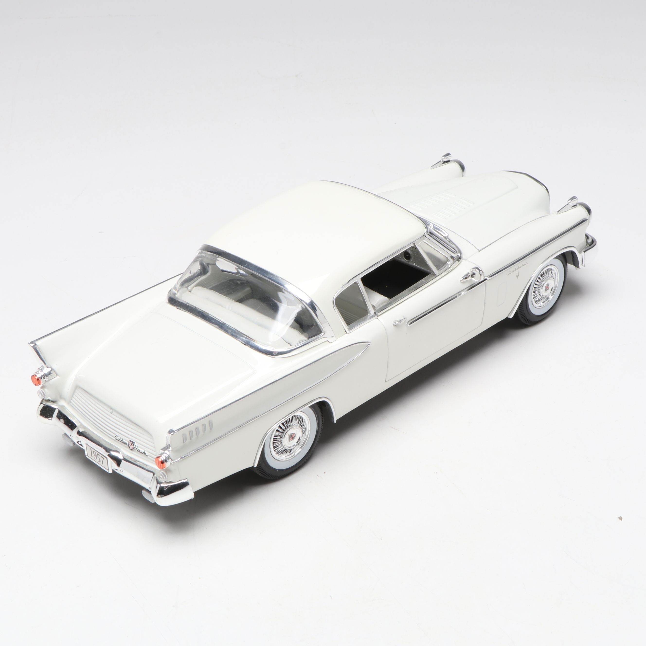 1957 Studebaker Gold Hawk with More Scale Model Diecast Cars and Stands