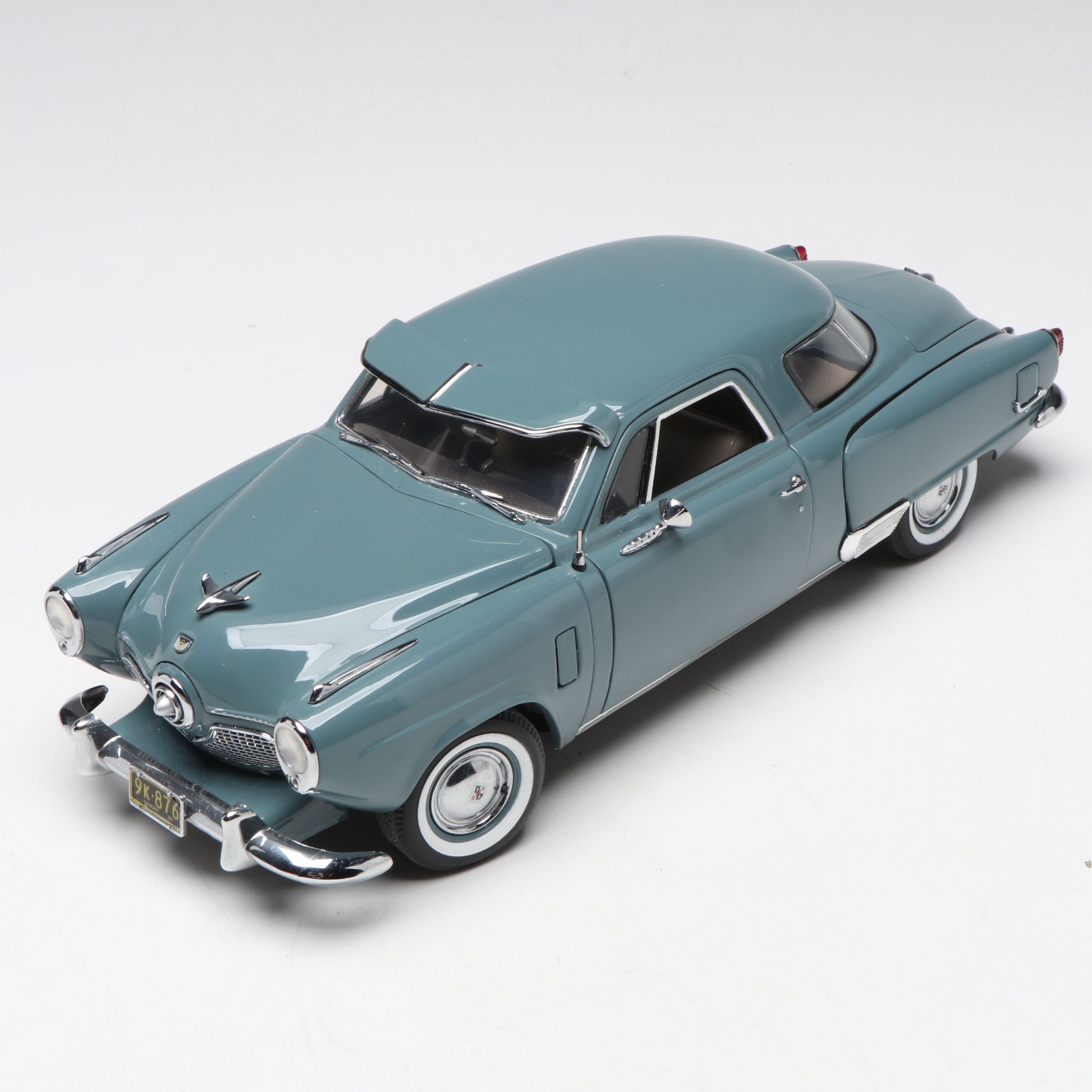 1957 Studebaker Gold Hawk with More Scale Model Diecast Cars and Stands