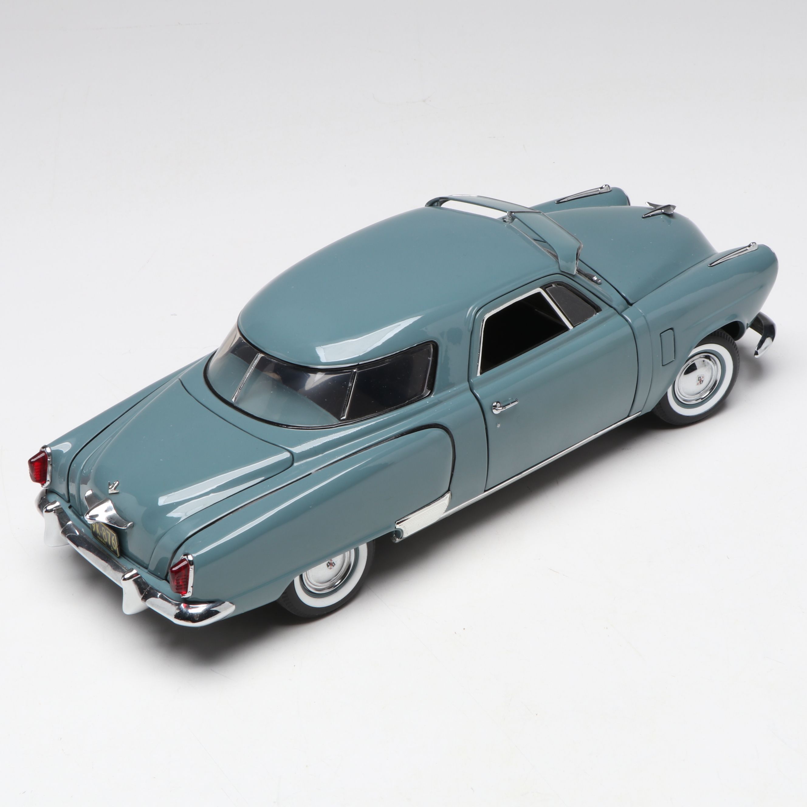 1957 Studebaker Gold Hawk with More Scale Model Diecast Cars and Stands