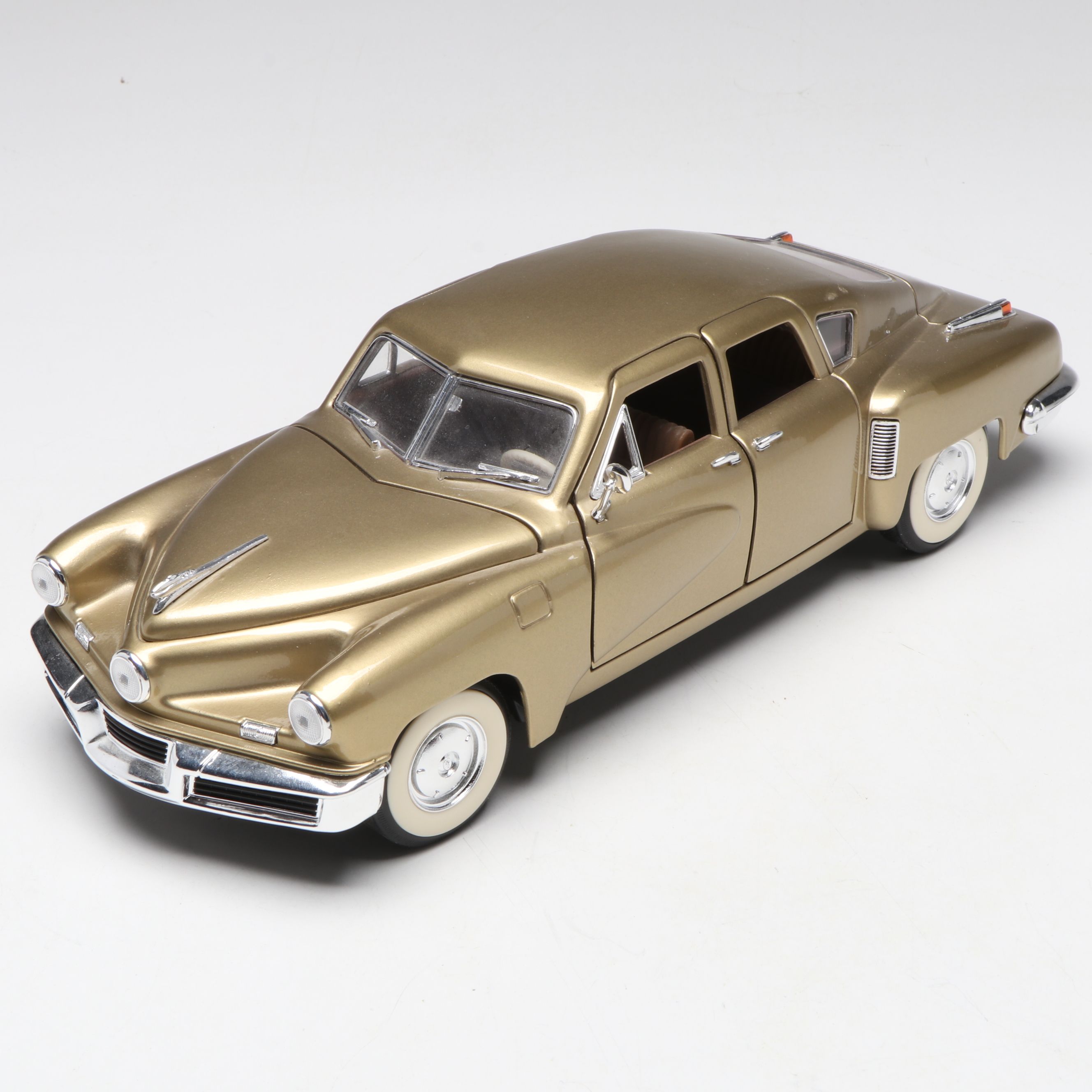 1957 Studebaker Gold Hawk with More Scale Model Diecast Cars and Stands