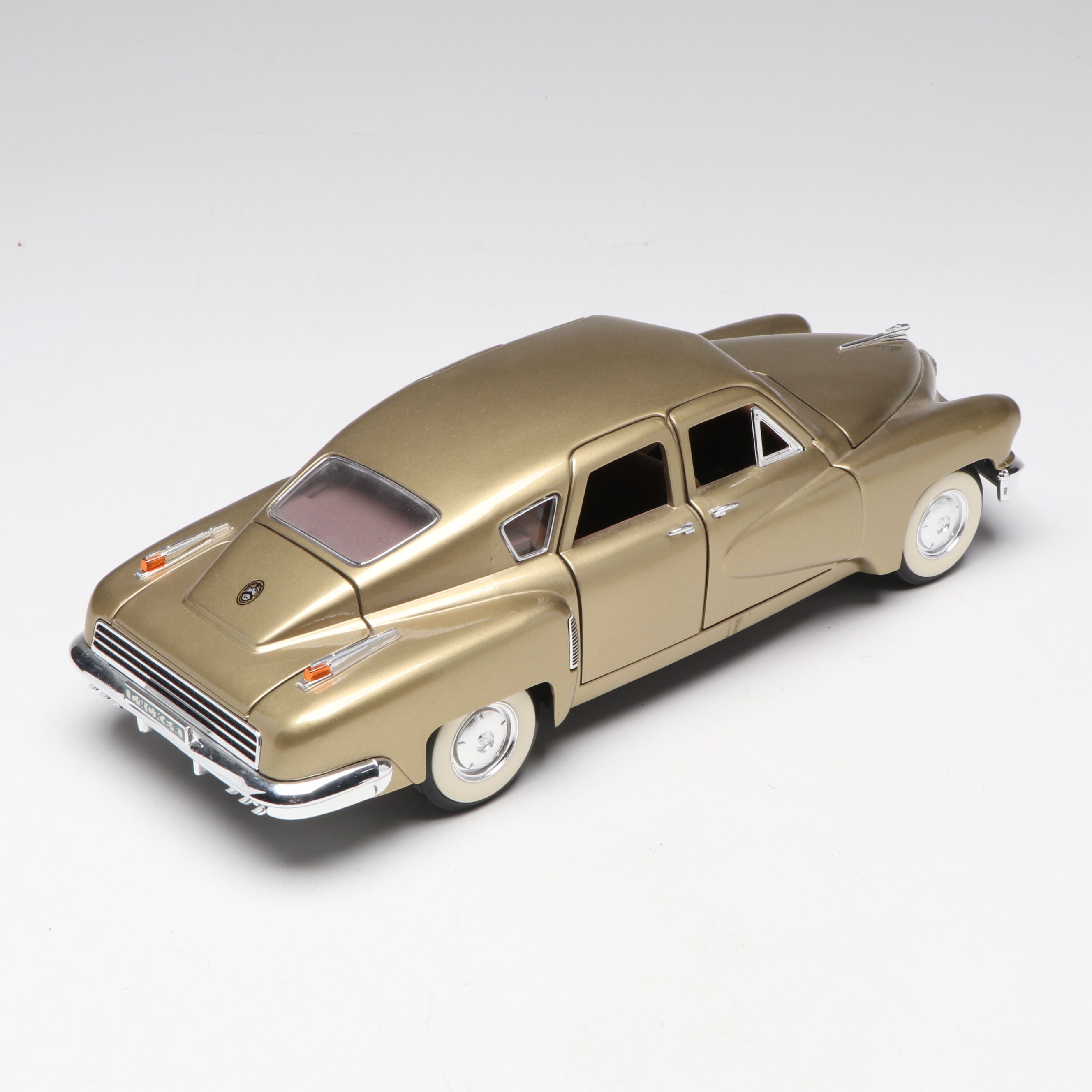 1957 Studebaker Gold Hawk with More Scale Model Diecast Cars and Stands