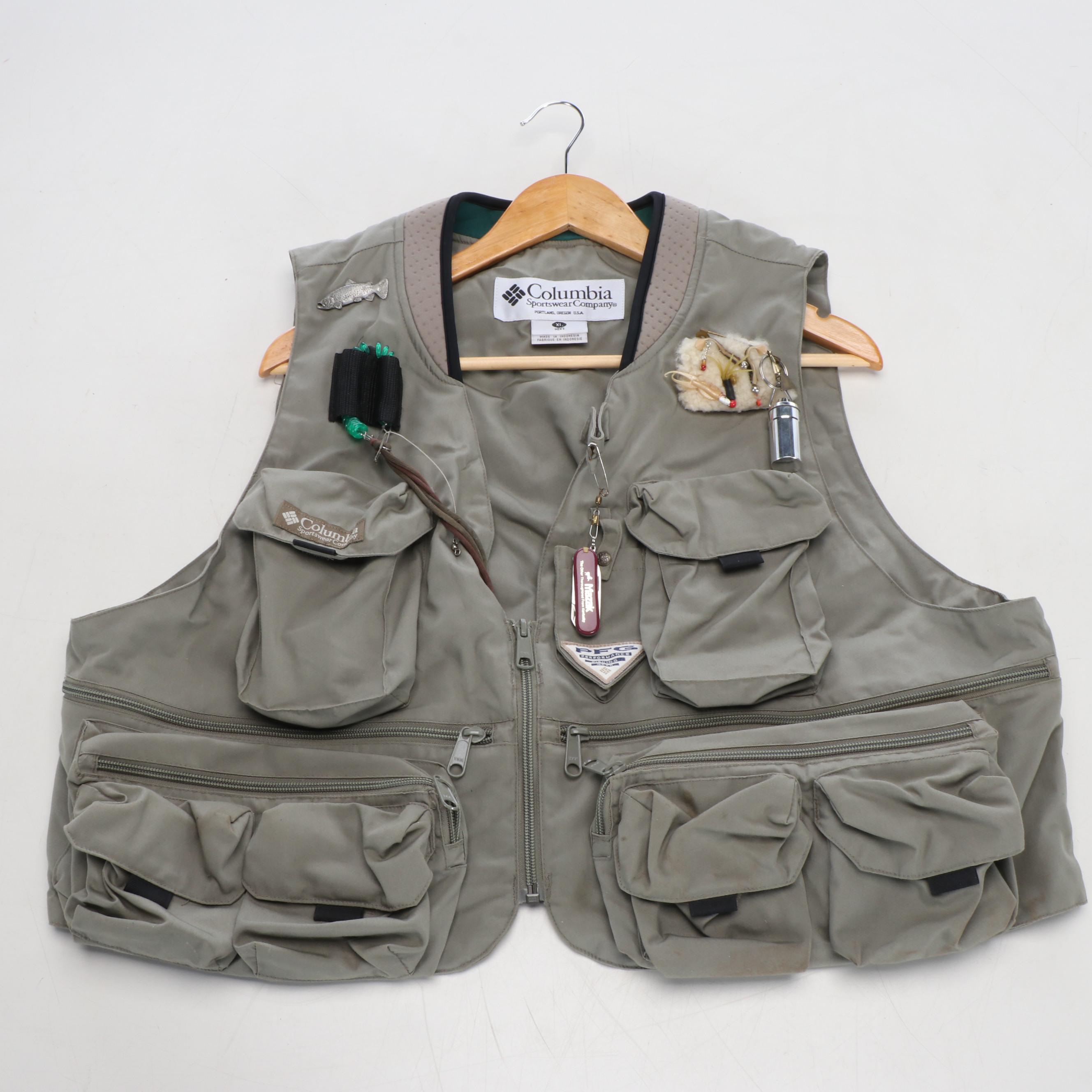 Columbia Fishing Vest with Shakespeare and Other Fishing Poles and Gear