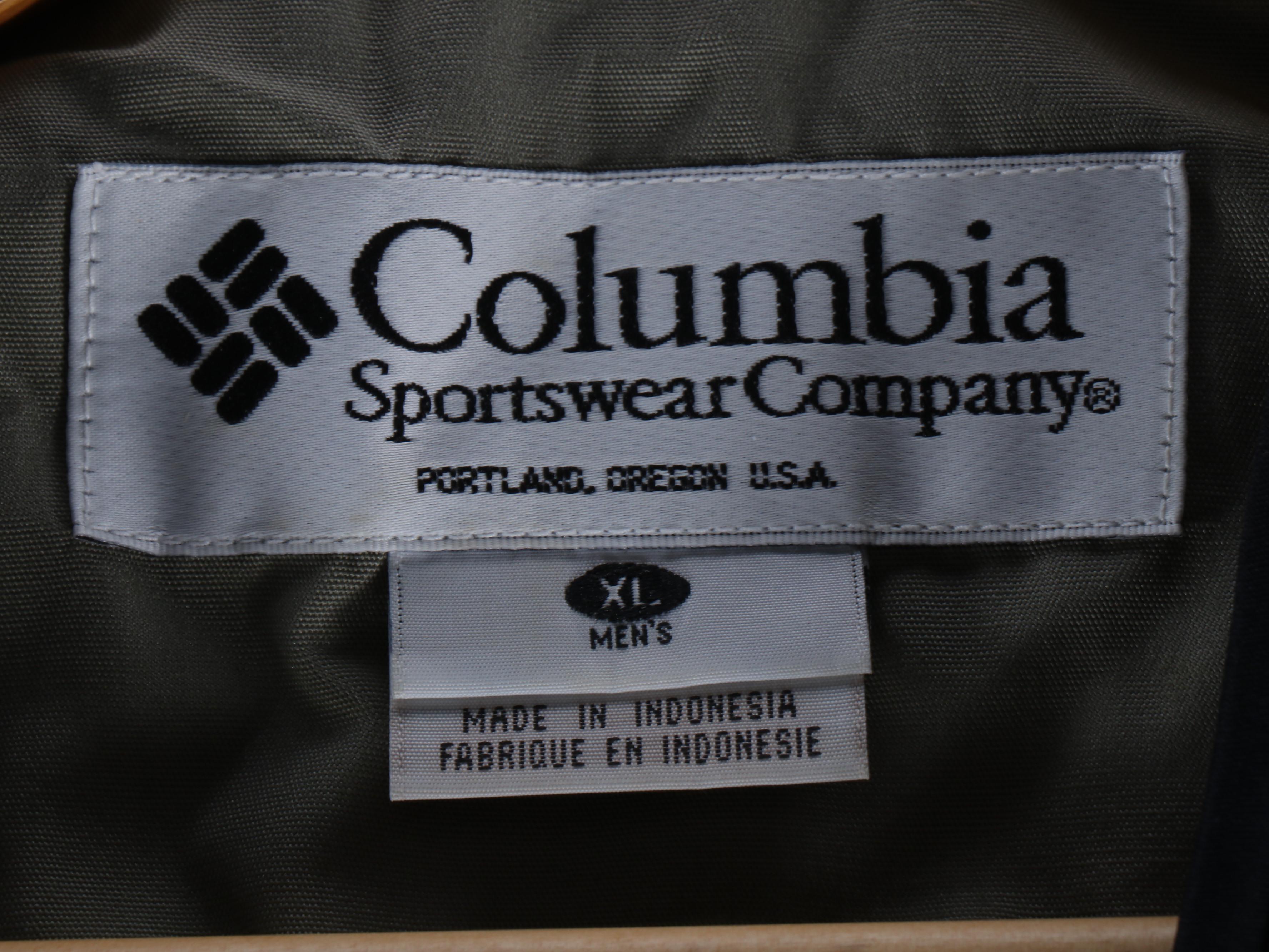 Columbia Fishing Vest with Shakespeare and Other Fishing Poles and Gear