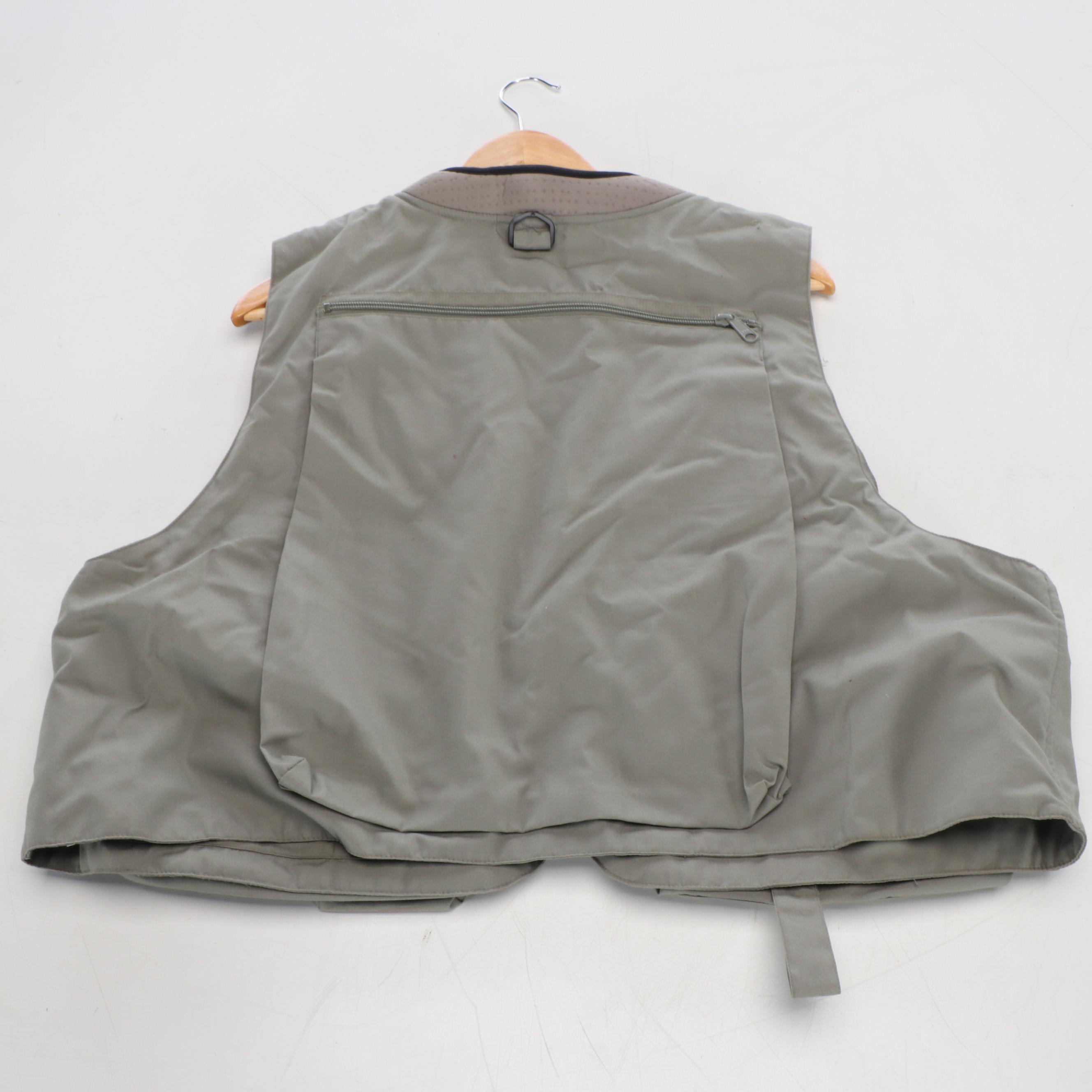 Columbia Fishing Vest with Shakespeare and Other Fishing Poles and Gear