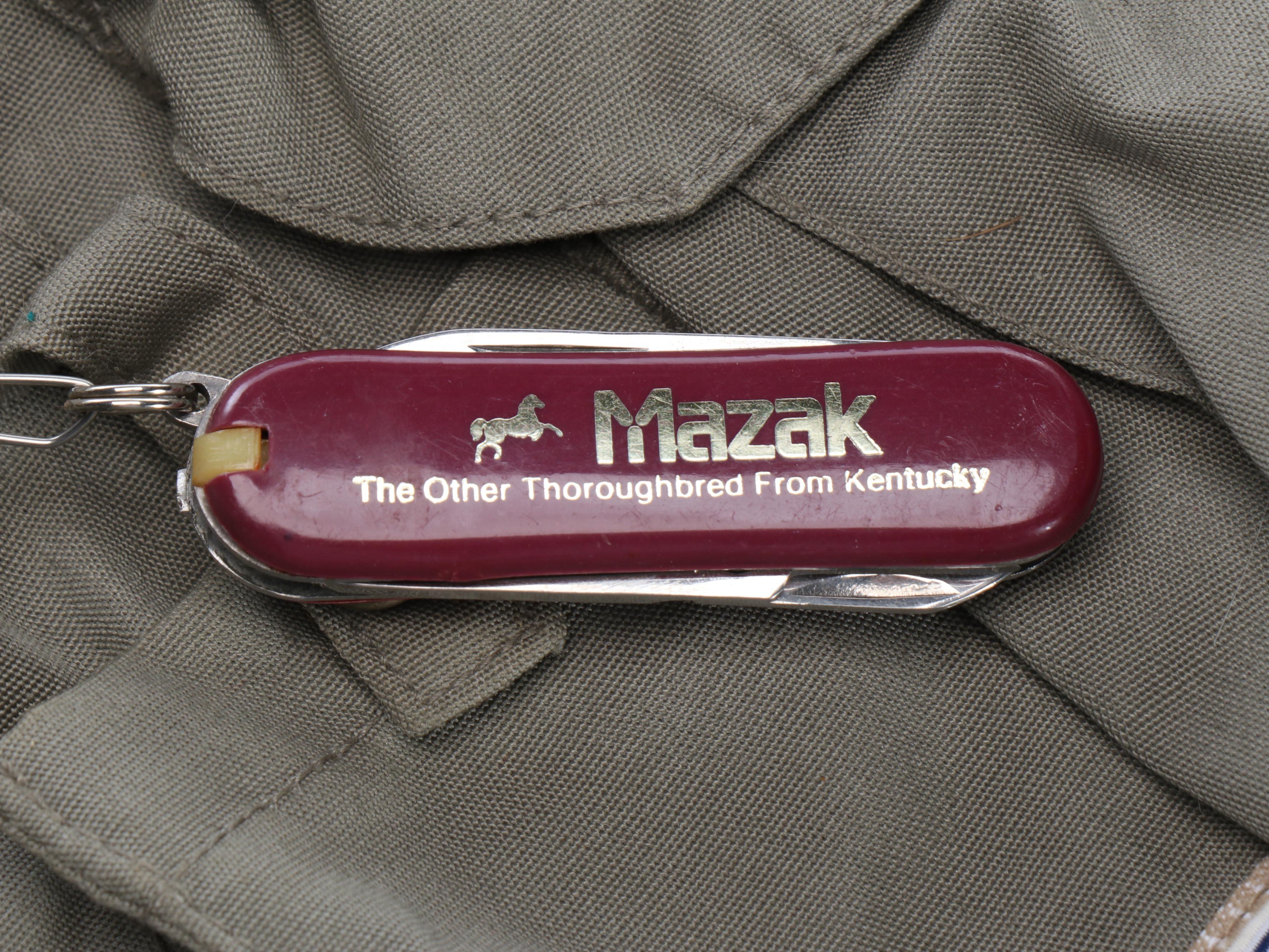 Columbia Fishing Vest with Shakespeare and Other Fishing Poles and Gear