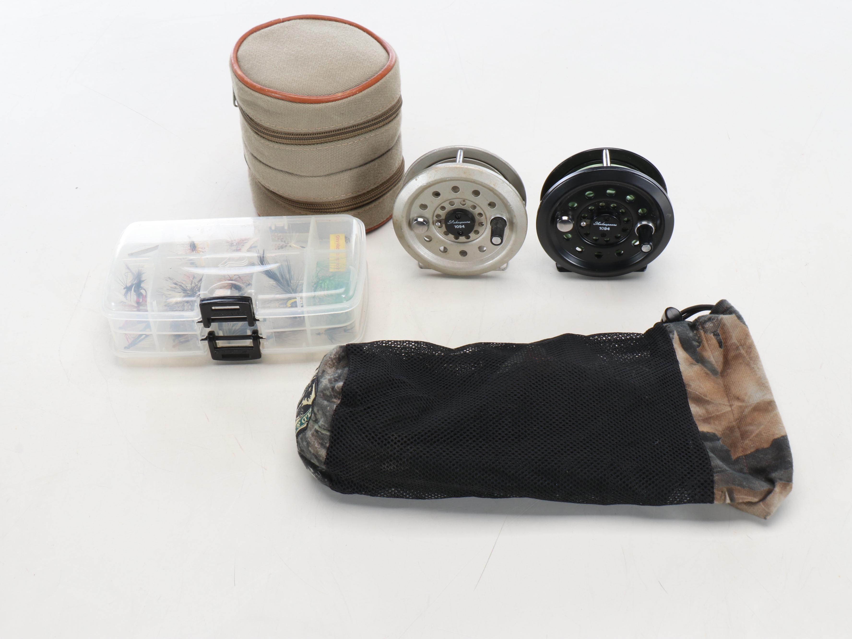 Columbia Fishing Vest with Shakespeare and Other Fishing Poles and Gear