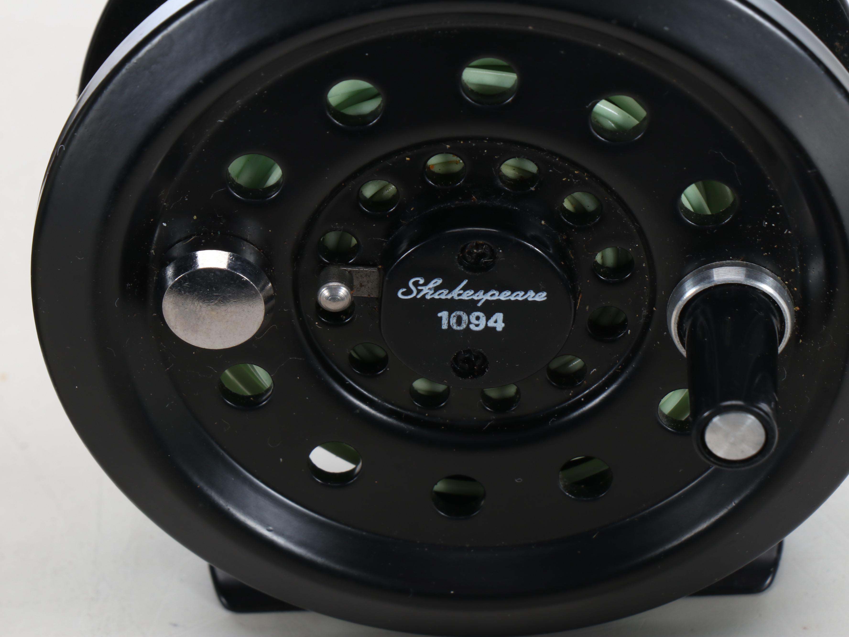 Columbia Fishing Vest with Shakespeare and Other Fishing Poles and Gear