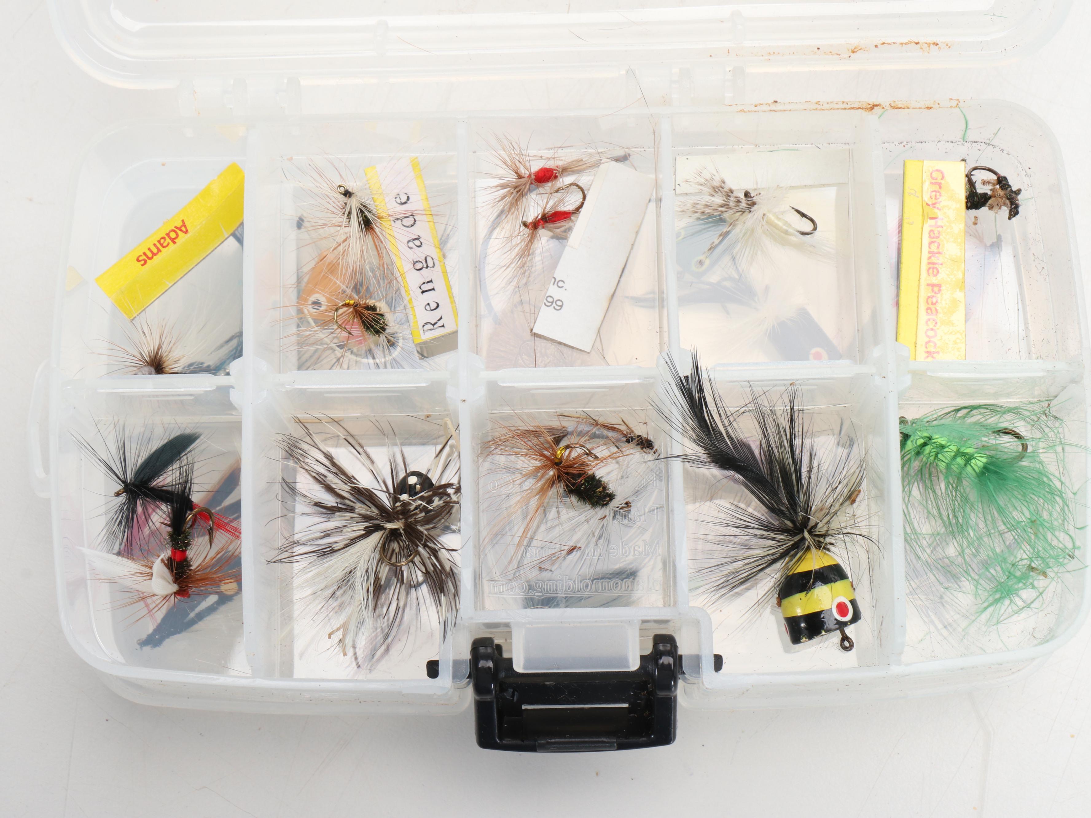 Columbia Fishing Vest with Shakespeare and Other Fishing Poles and Gear