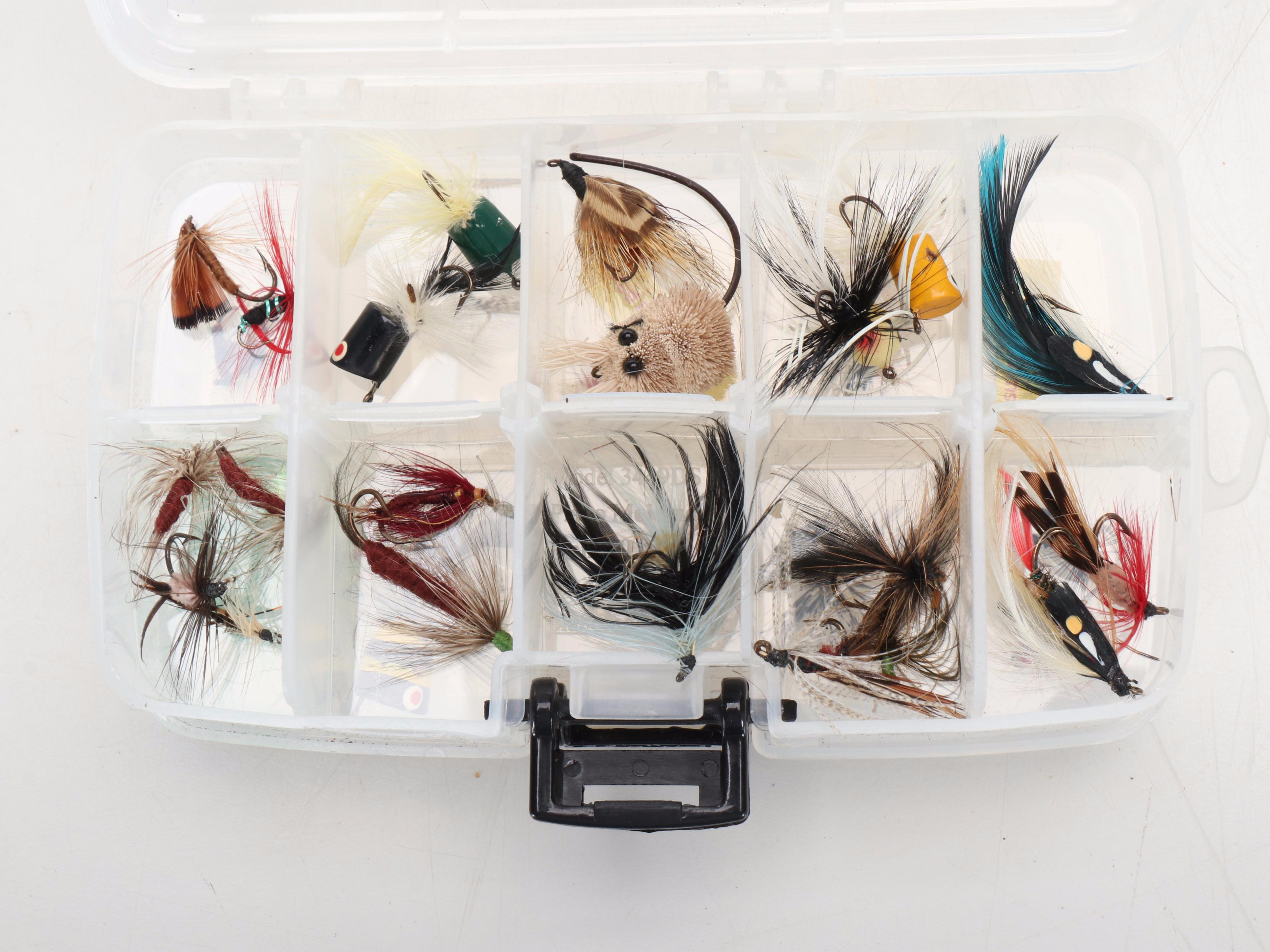 Columbia Fishing Vest with Shakespeare and Other Fishing Poles and Gear