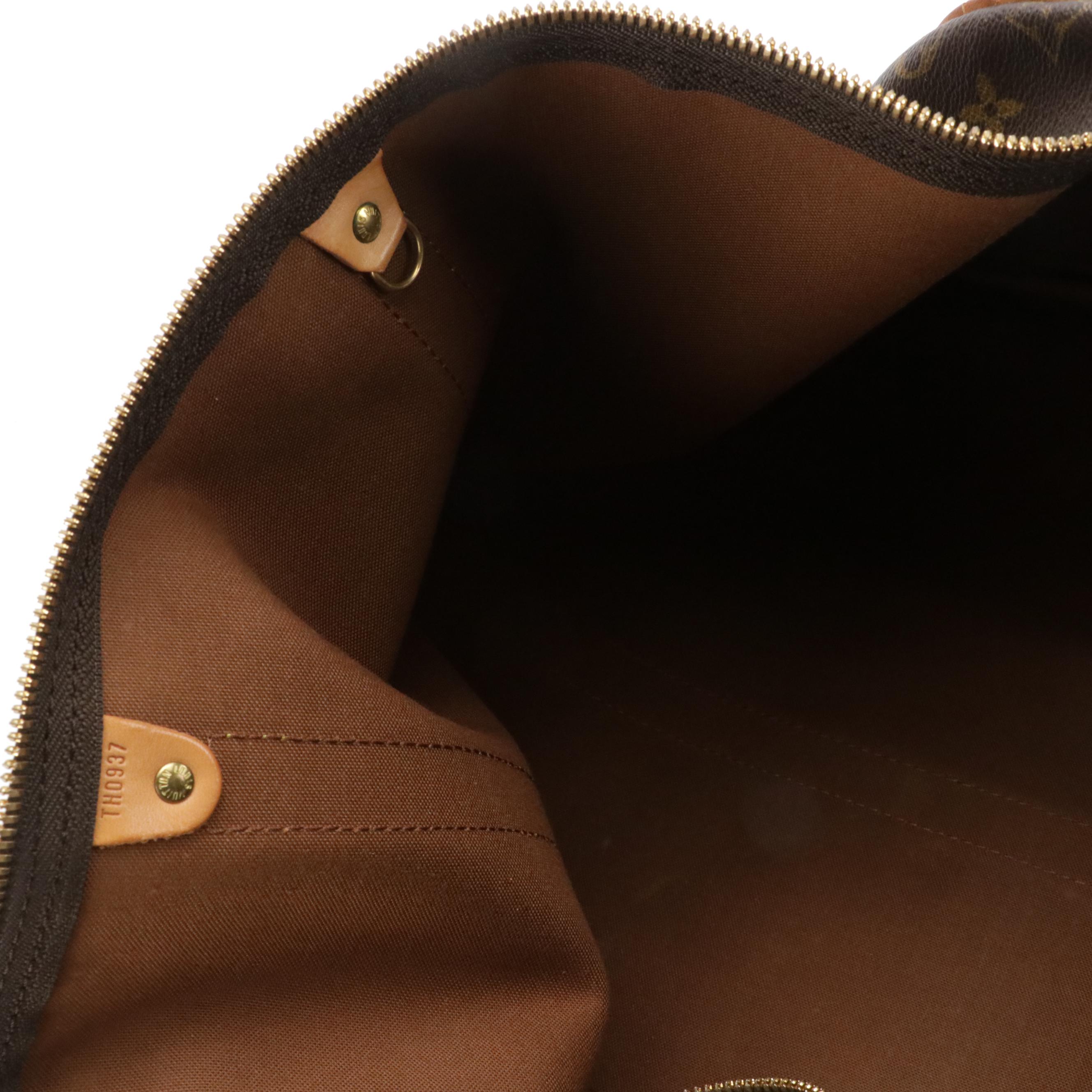 Louis Vuitton Keepall 55 Two-Way Duffle Bag in Monogram Canvas and Leather Trim