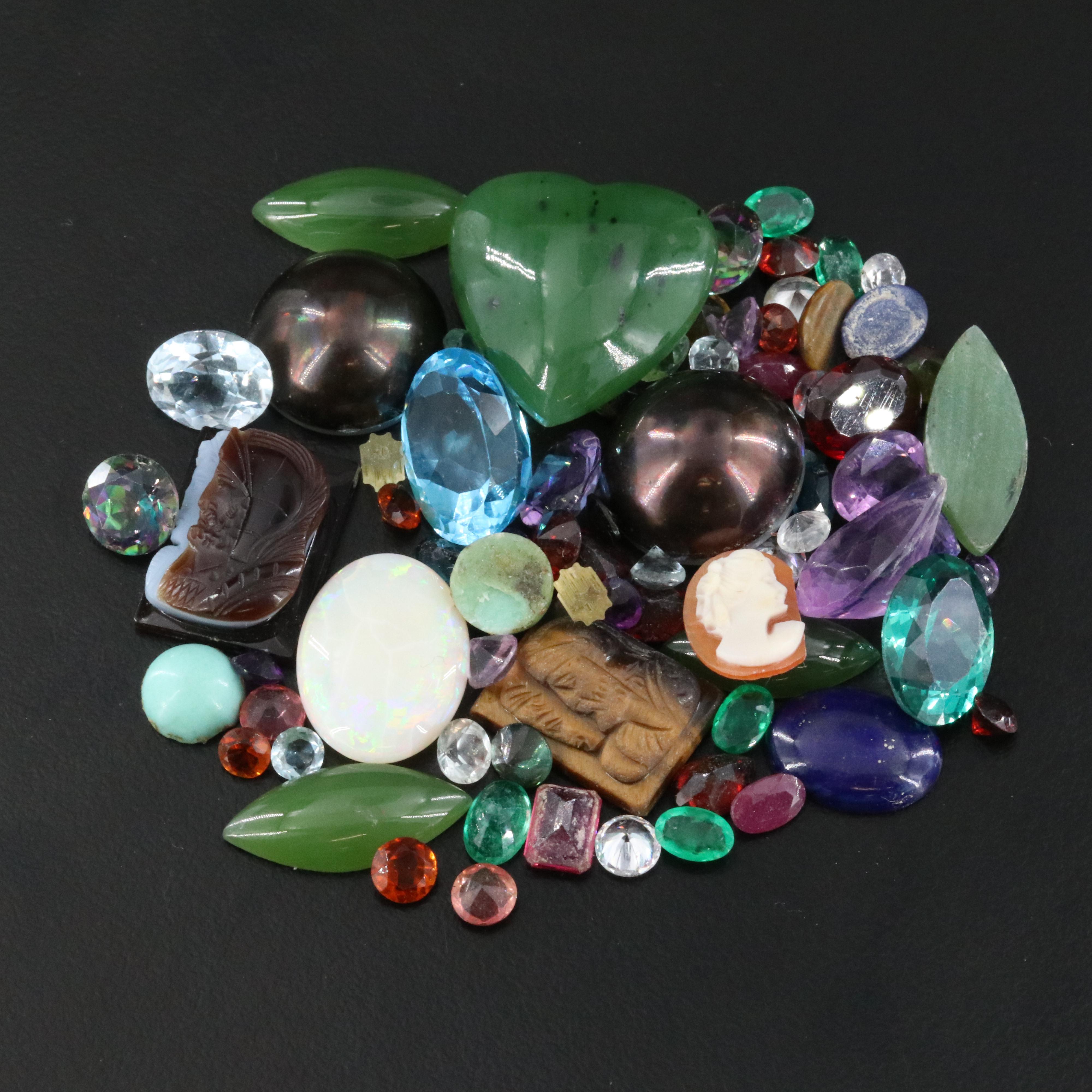 Loose Gemstones Featuring Topaz, Emerald and Amethyst