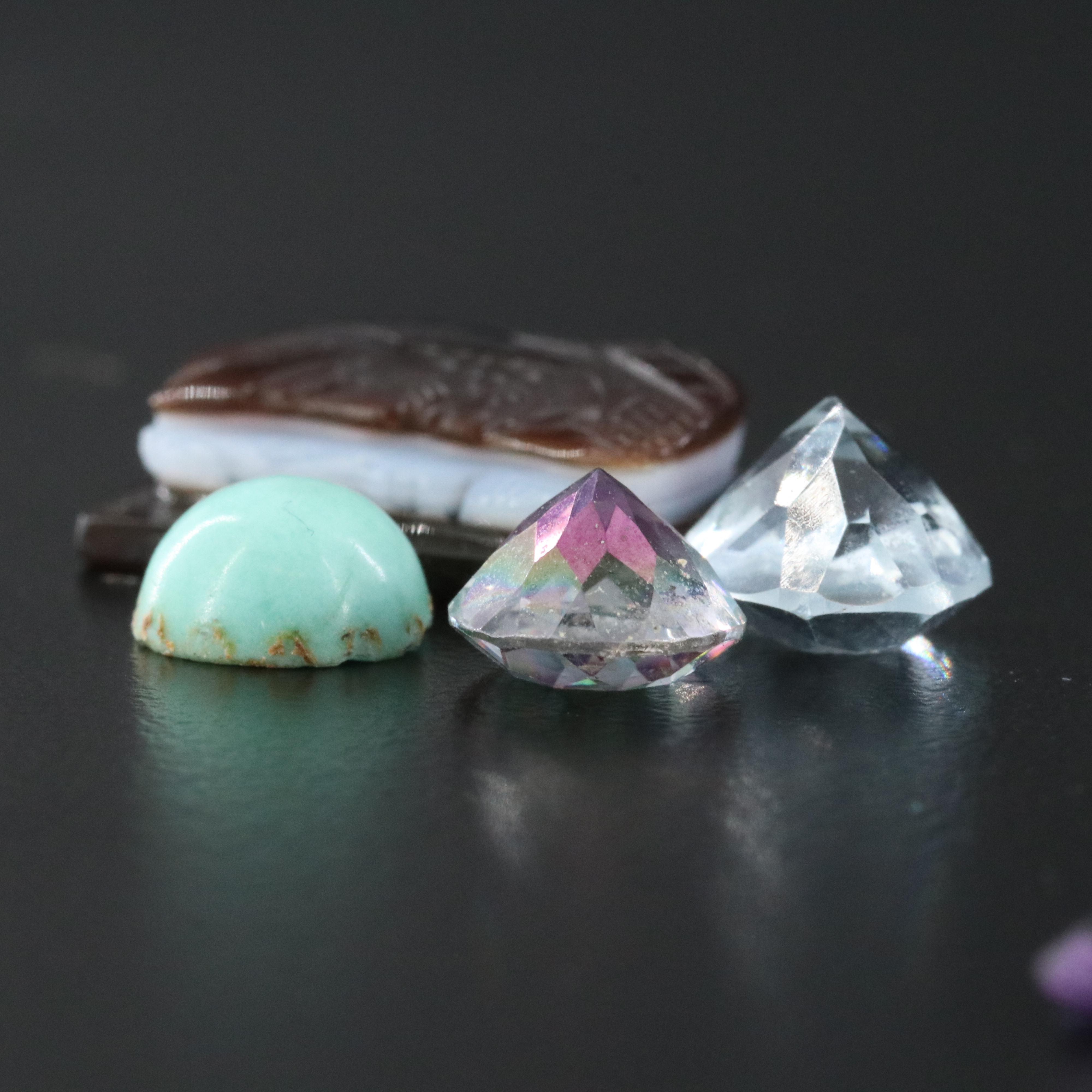 Loose Gemstones Featuring Topaz, Emerald and Amethyst