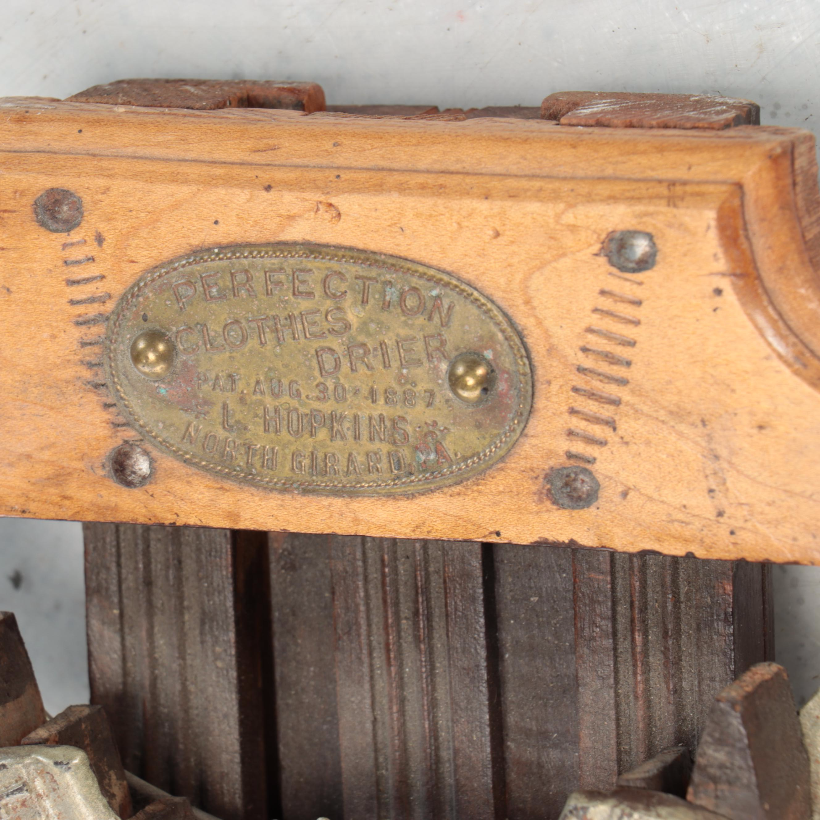 L. Hopkins Wood and Cast Iron Wall Mount Collapsible Laundry Rack, Early 20th C.