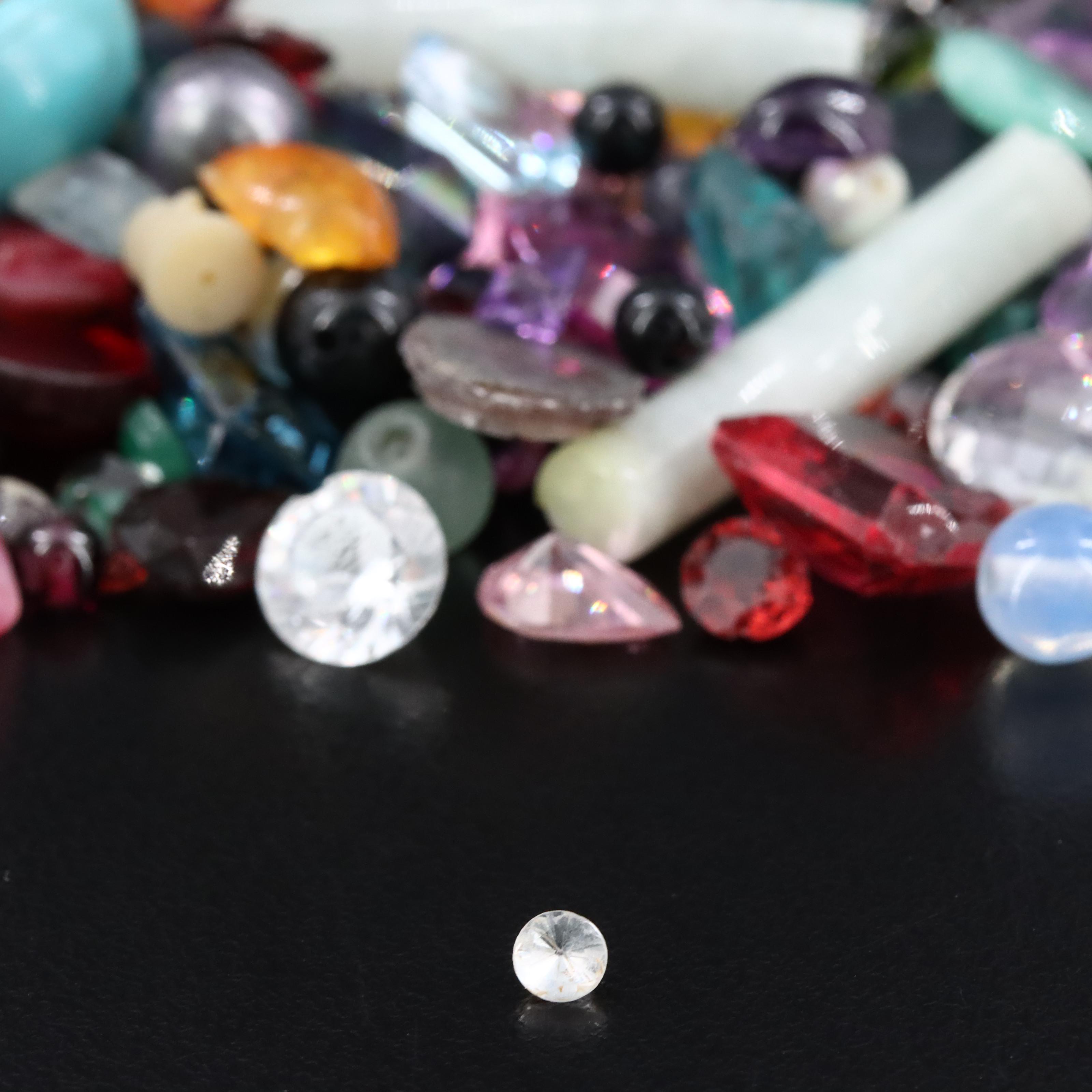 Loose Gemstone Selection Including Aquamarine and Garnets