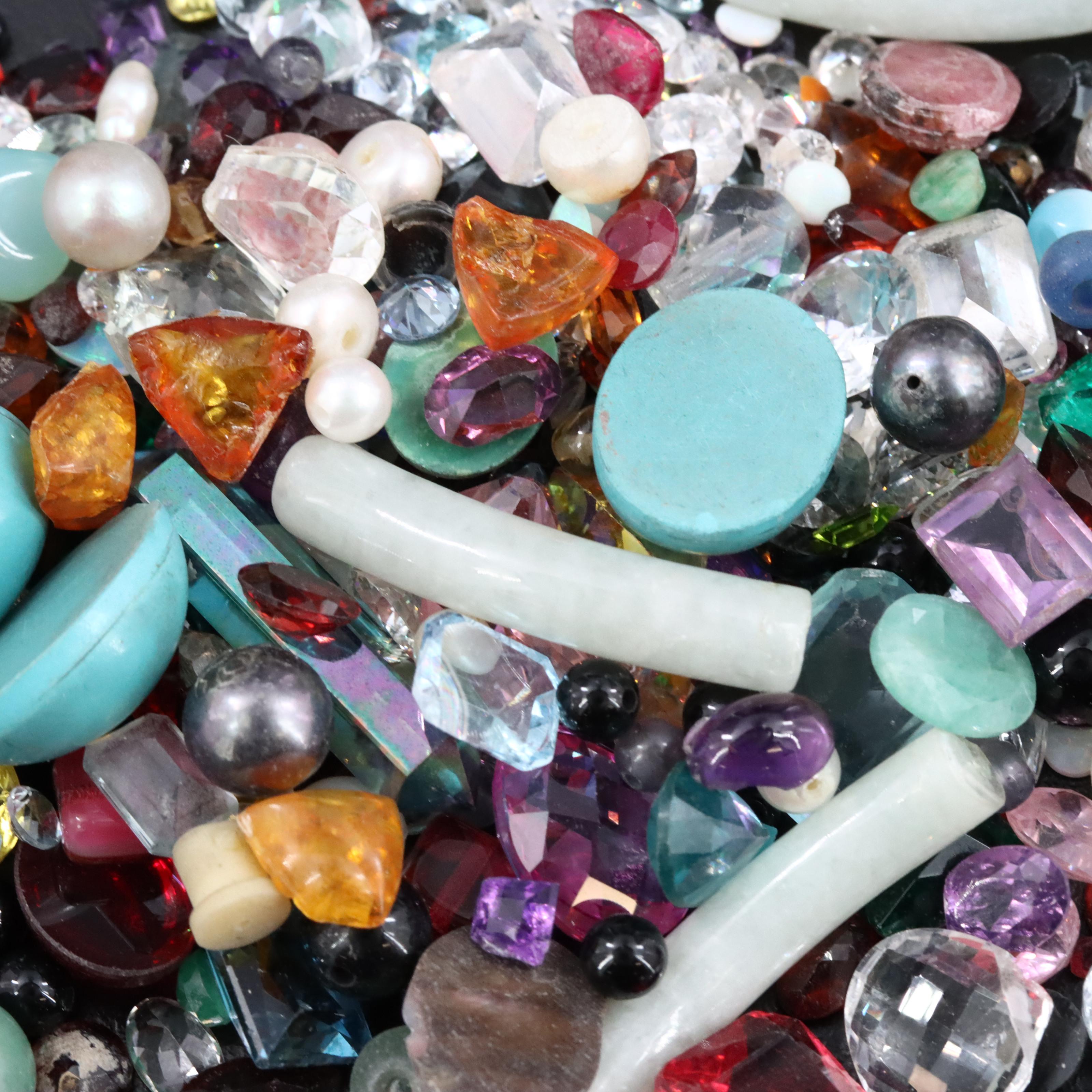 Loose Gemstone Selection Including Aquamarine and Garnets