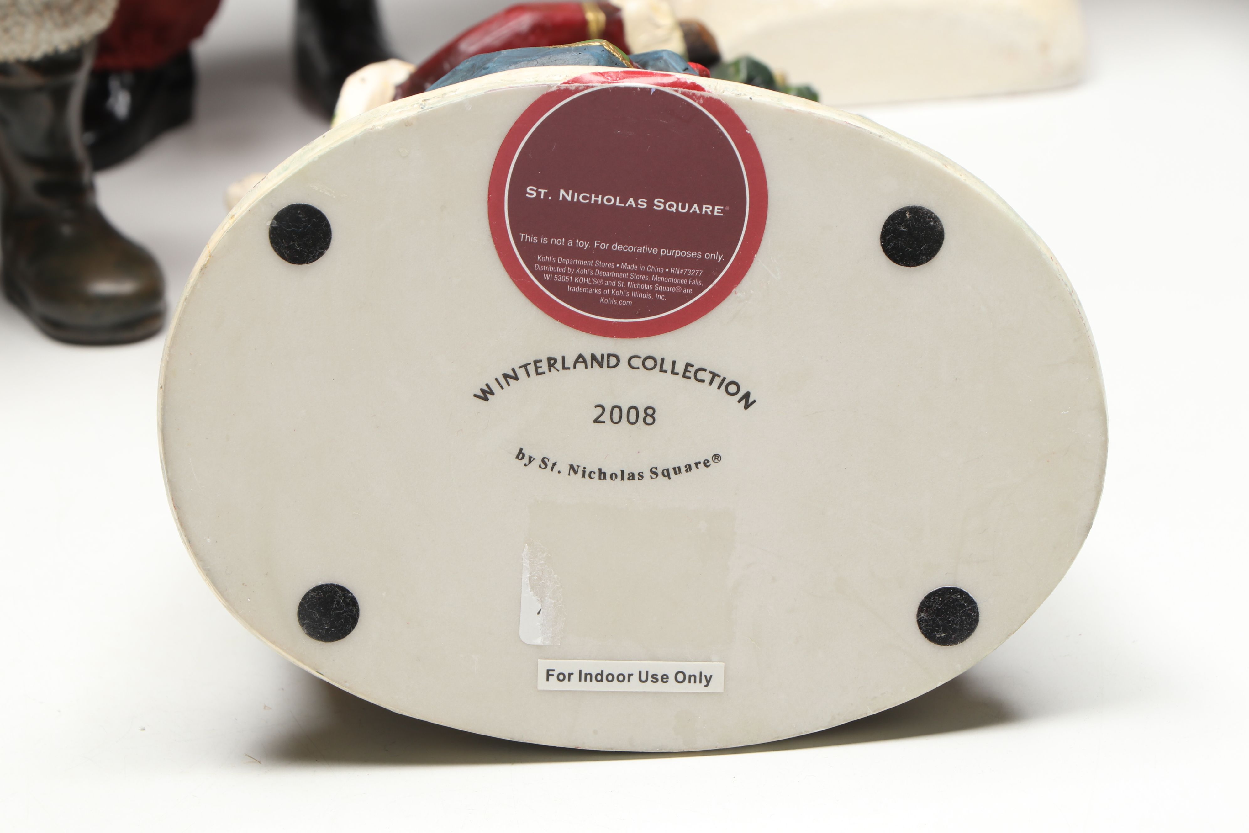 St. Nicholas Square and Other Resin Santa Claus Figurines