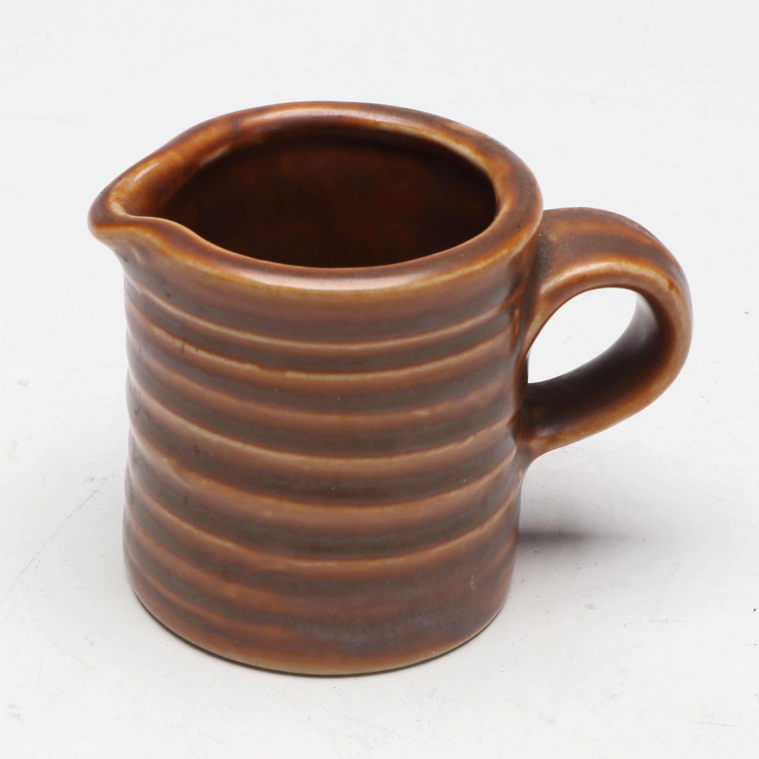 McCoy Pottery Botanical and Aquatic Brown Pitchers with Ribbed Hull Creamer