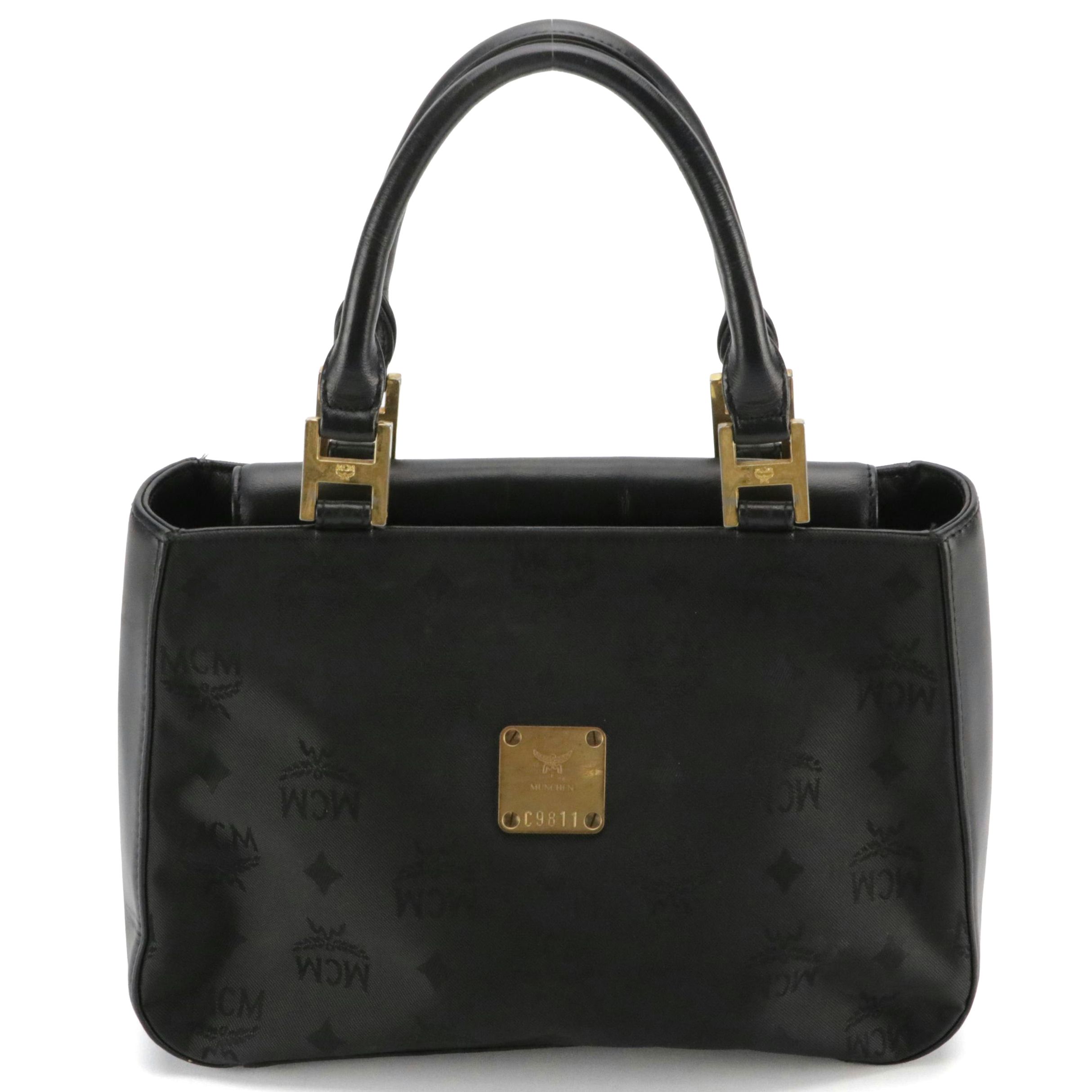 MCM Small Handbag in Black Visetos Jacquard Canvas and Calfskin Leather