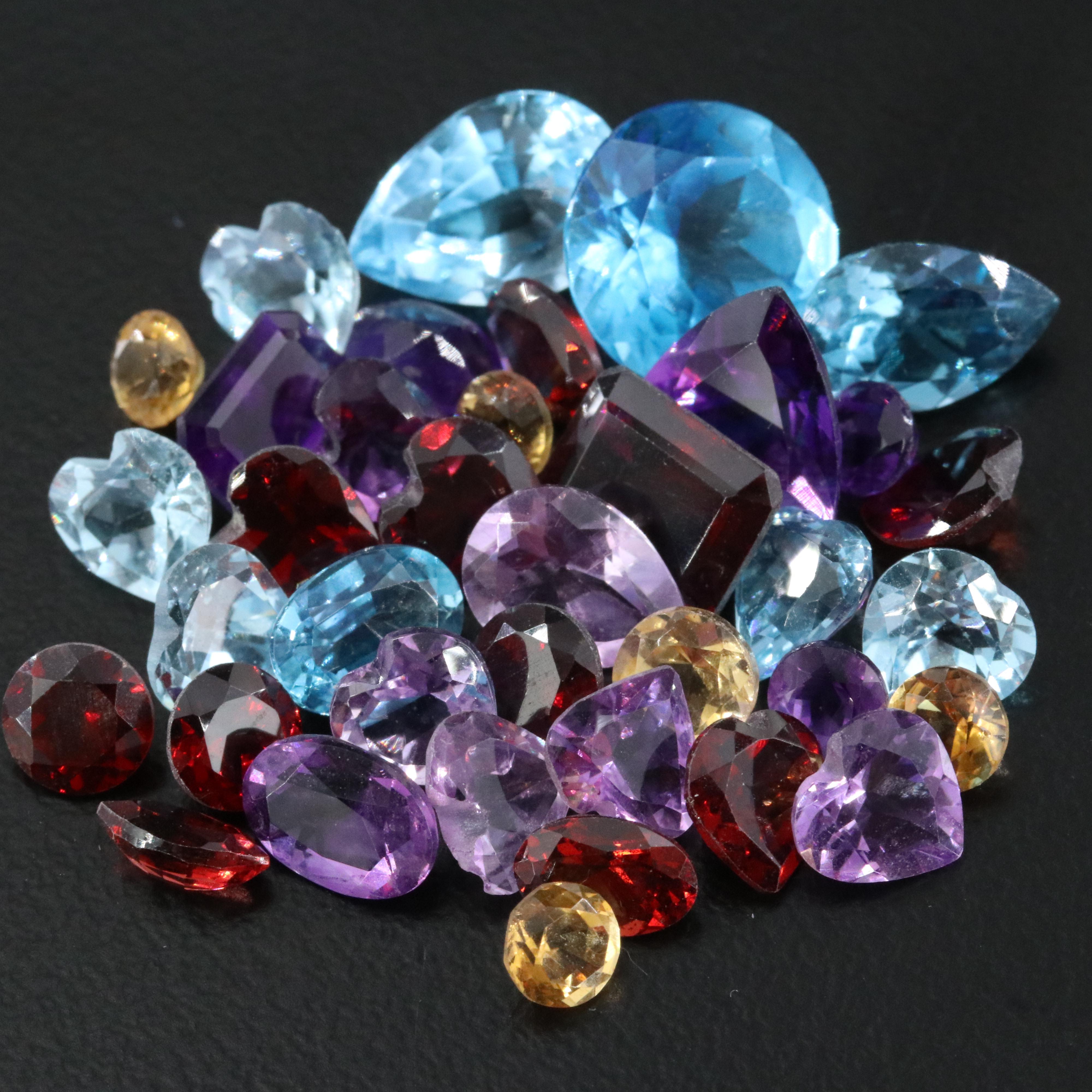 Loose 31.73 CTW Mixed Gemstones with Amethyst, Garnet, and Blue Topaz