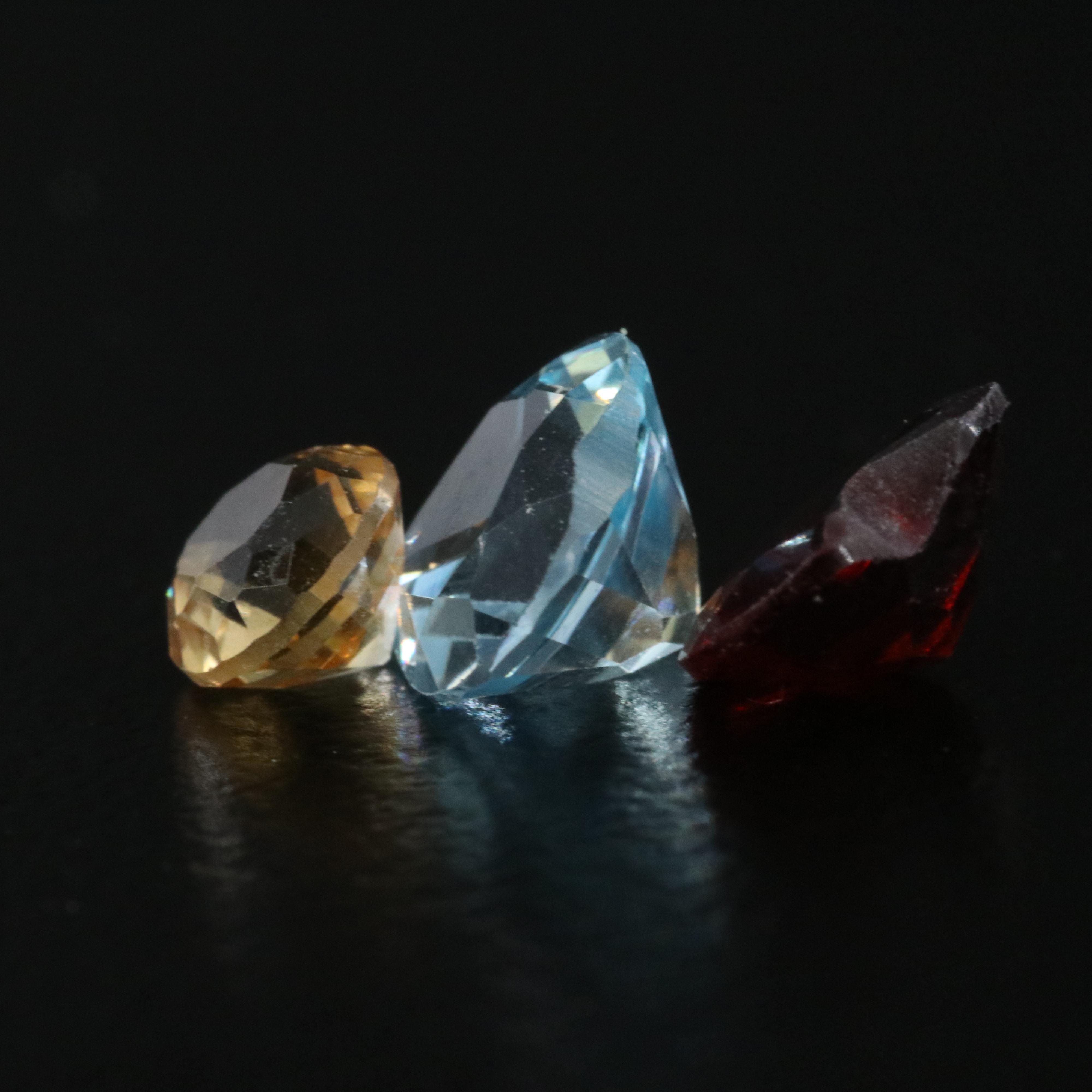 Loose 31.73 CTW Mixed Gemstones with Amethyst, Garnet, and Blue Topaz