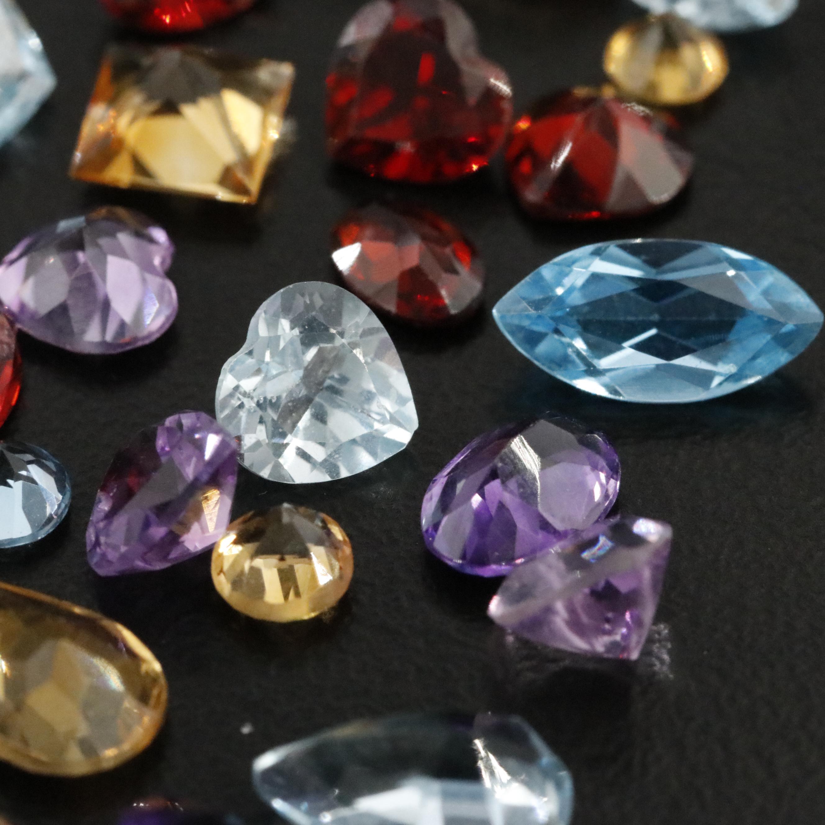 Loose 47.02 CTW Mixed Gemstone Lot with Citrine, Garnet and Amethyst
