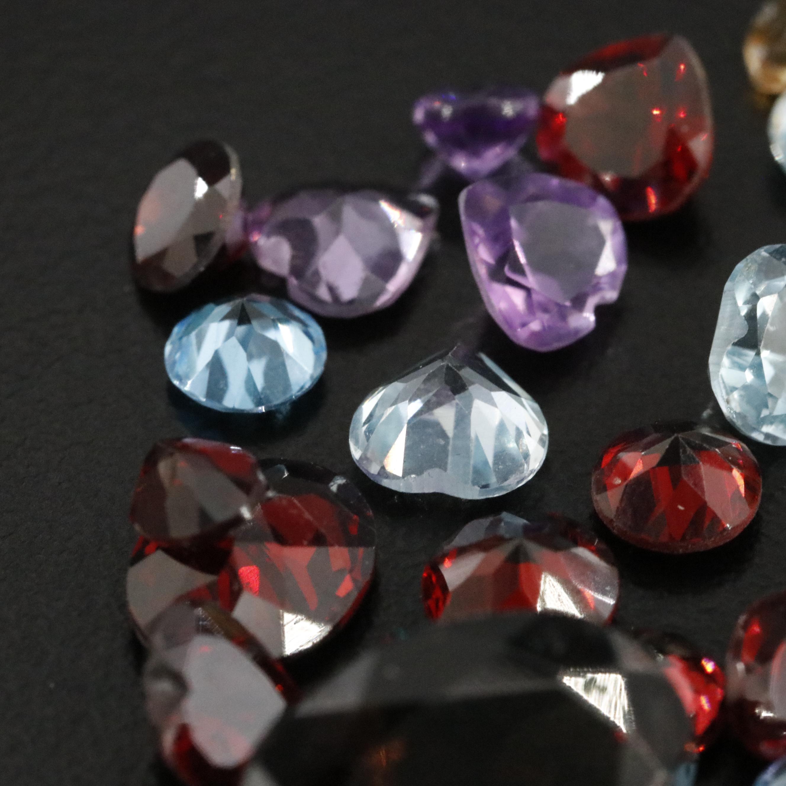 Loose 47.02 CTW Mixed Gemstone Lot with Citrine, Garnet and Amethyst