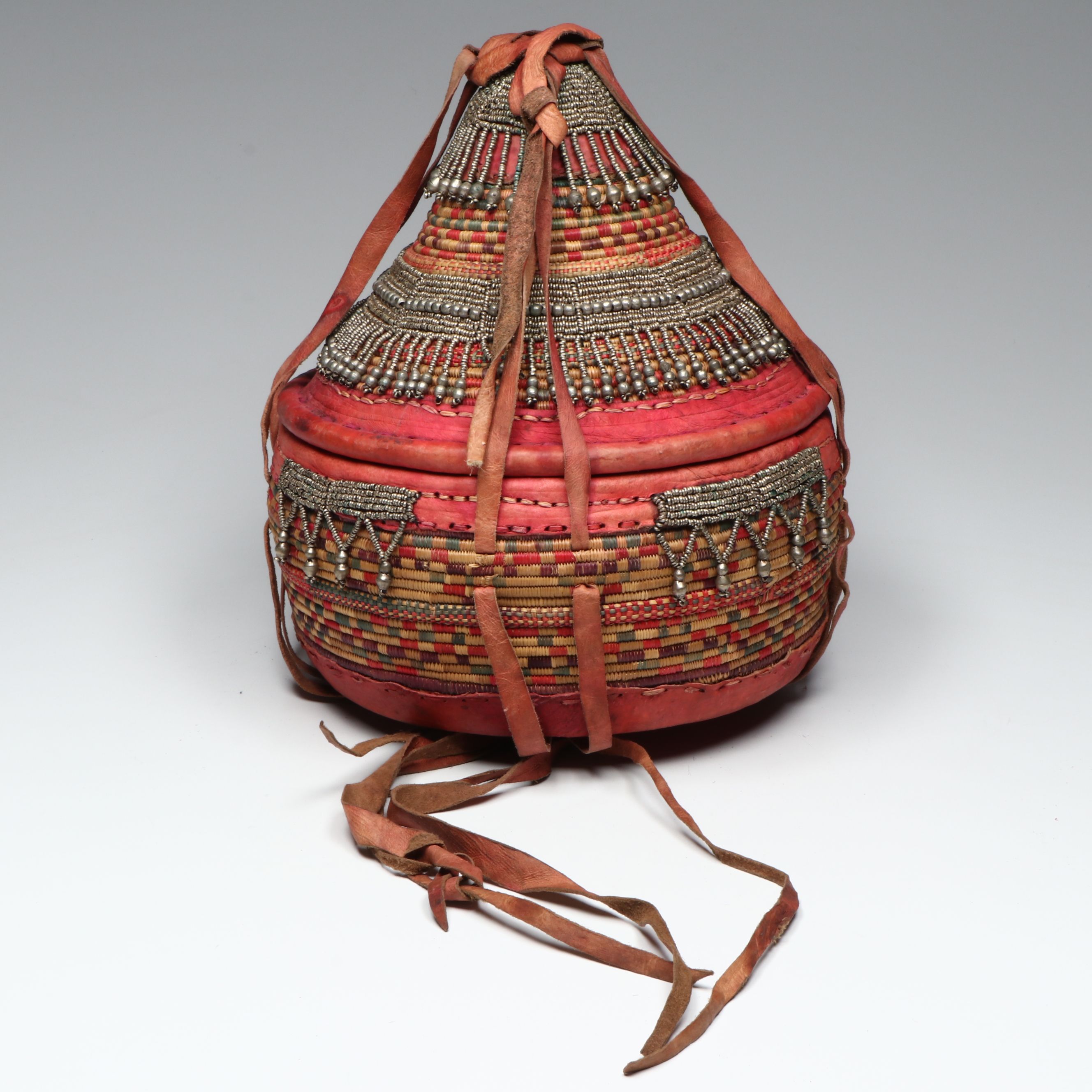 Ethiopian Oromo Peoples Woven Grass, Dyed Leather and Silver Bead Basket