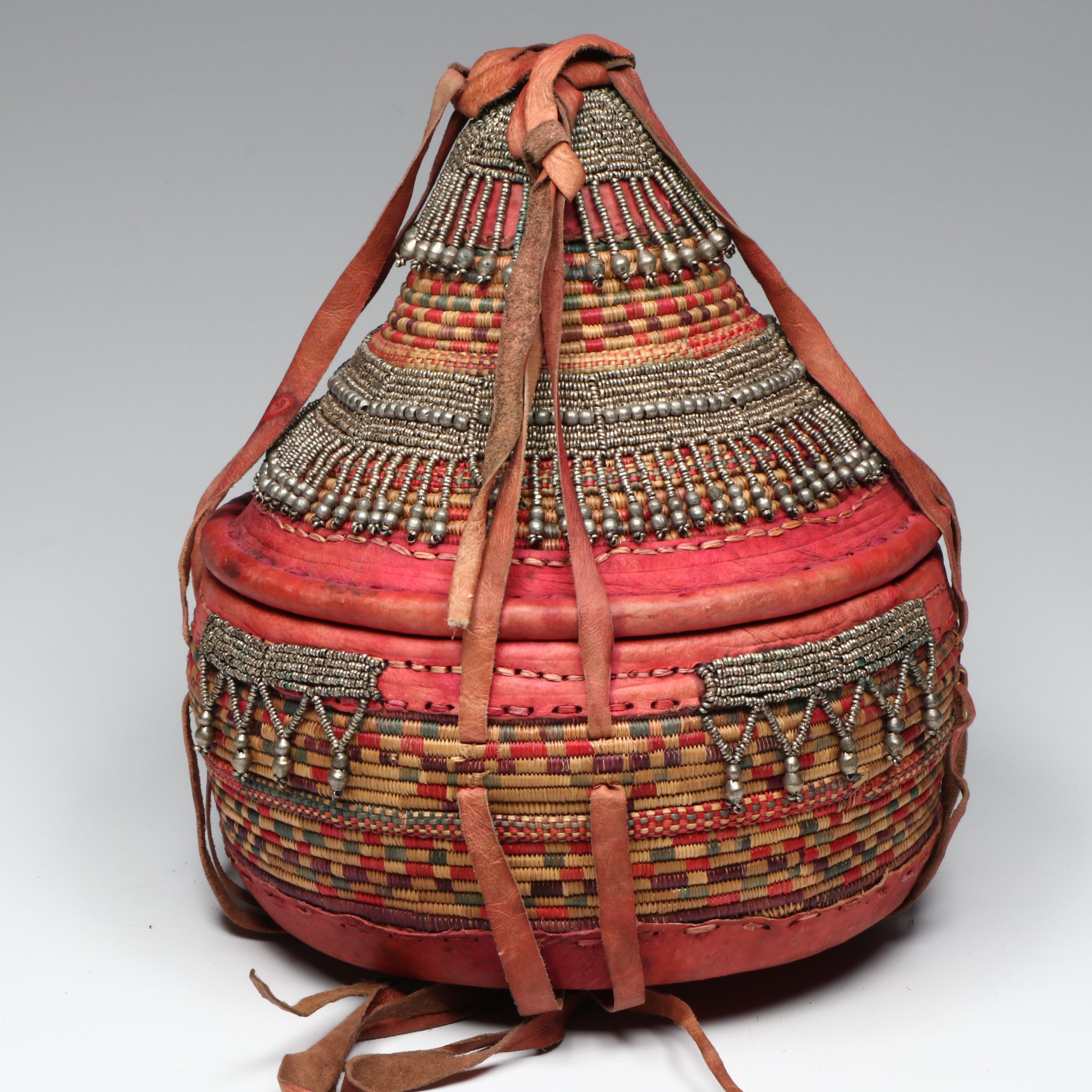 Ethiopian Oromo Peoples Woven Grass, Dyed Leather and Silver Bead Basket