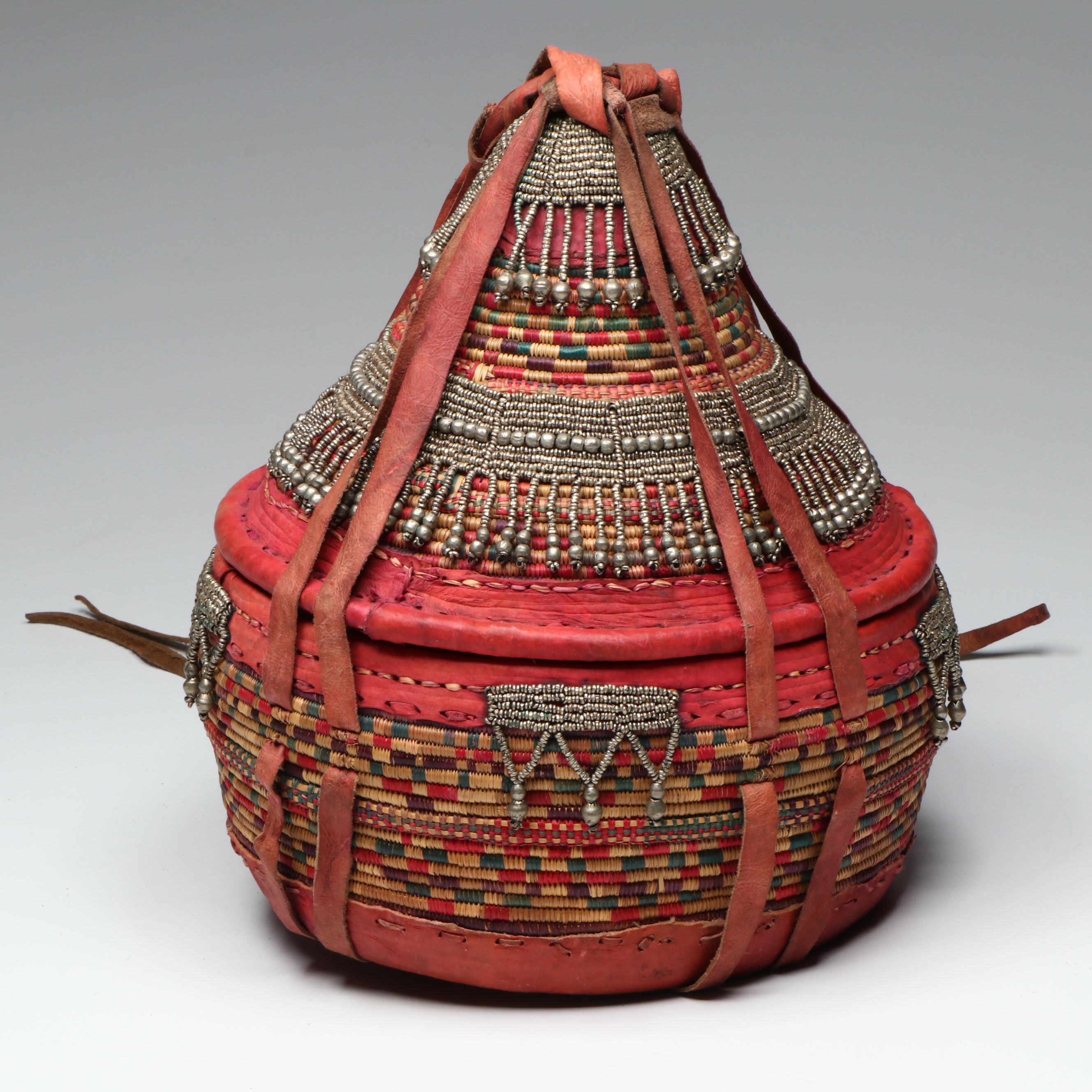 Ethiopian Oromo Peoples Woven Grass, Dyed Leather and Silver Bead Basket