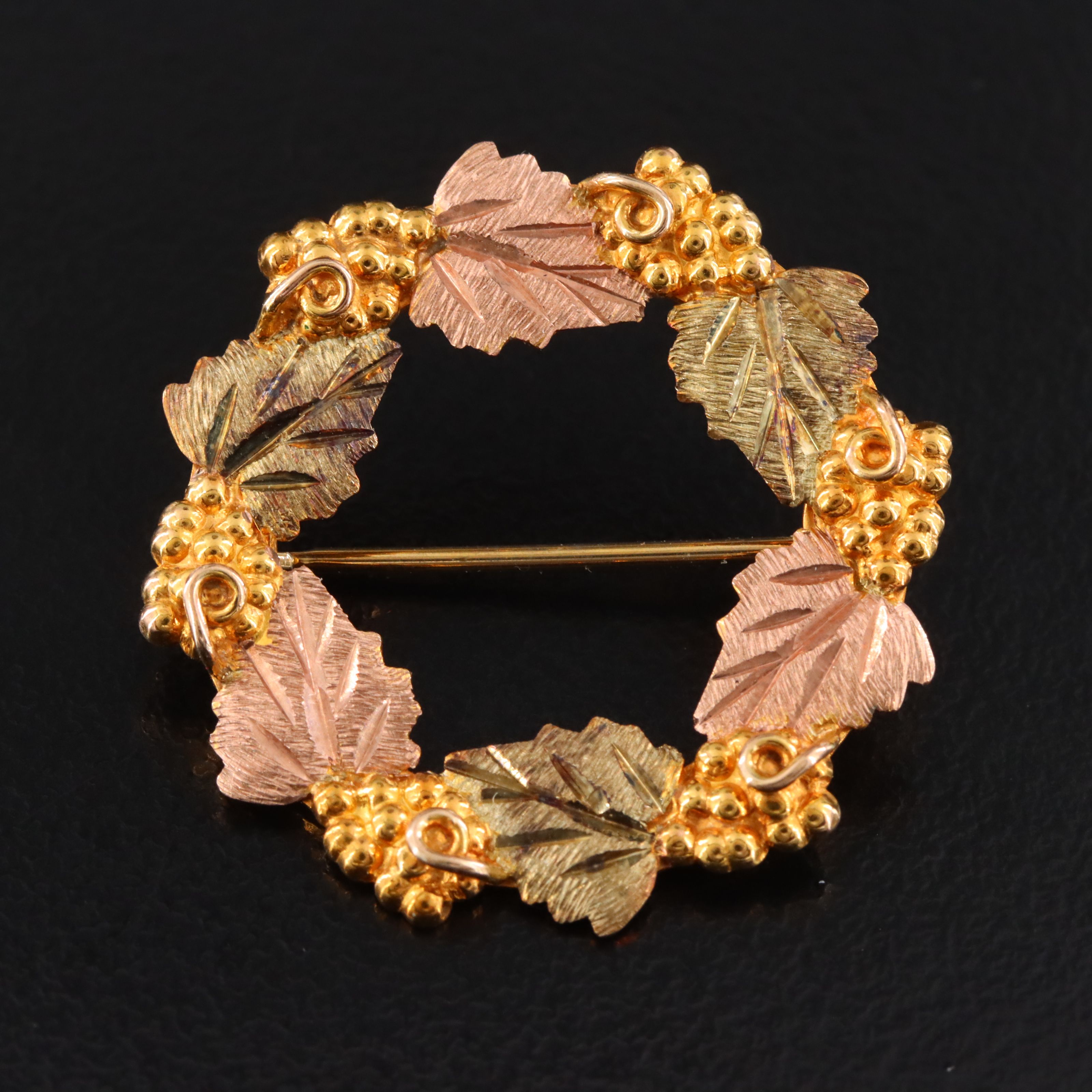 Landstrom's Black Hills Gold 10K Wreath Brooch with Rose and Green Gold Accents