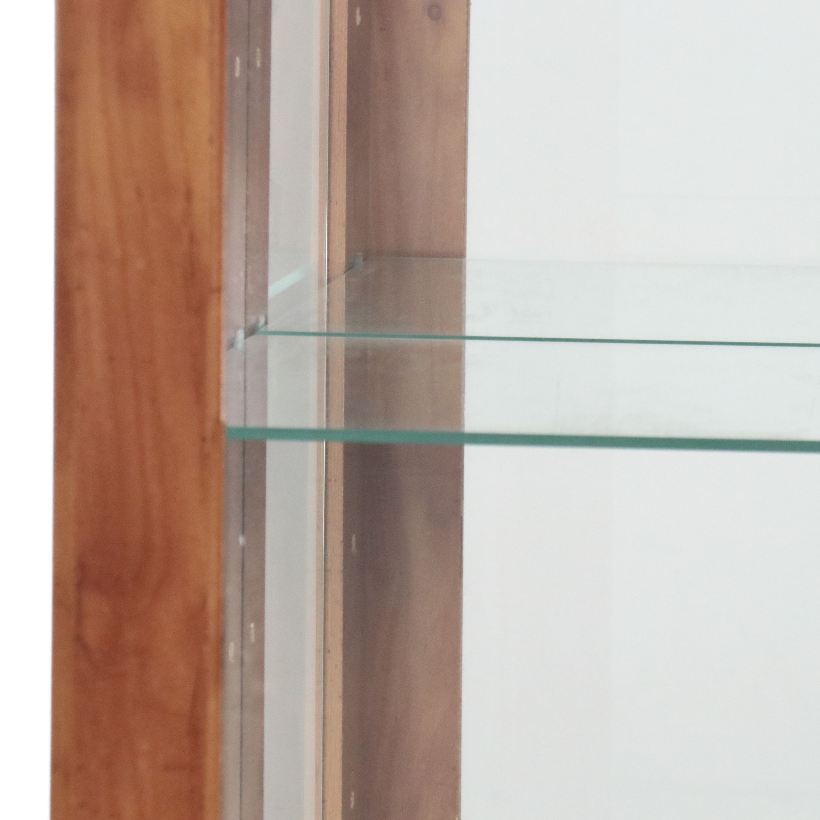 Illuminated Pine Curio Cabinet with Scrolled Metal Accent