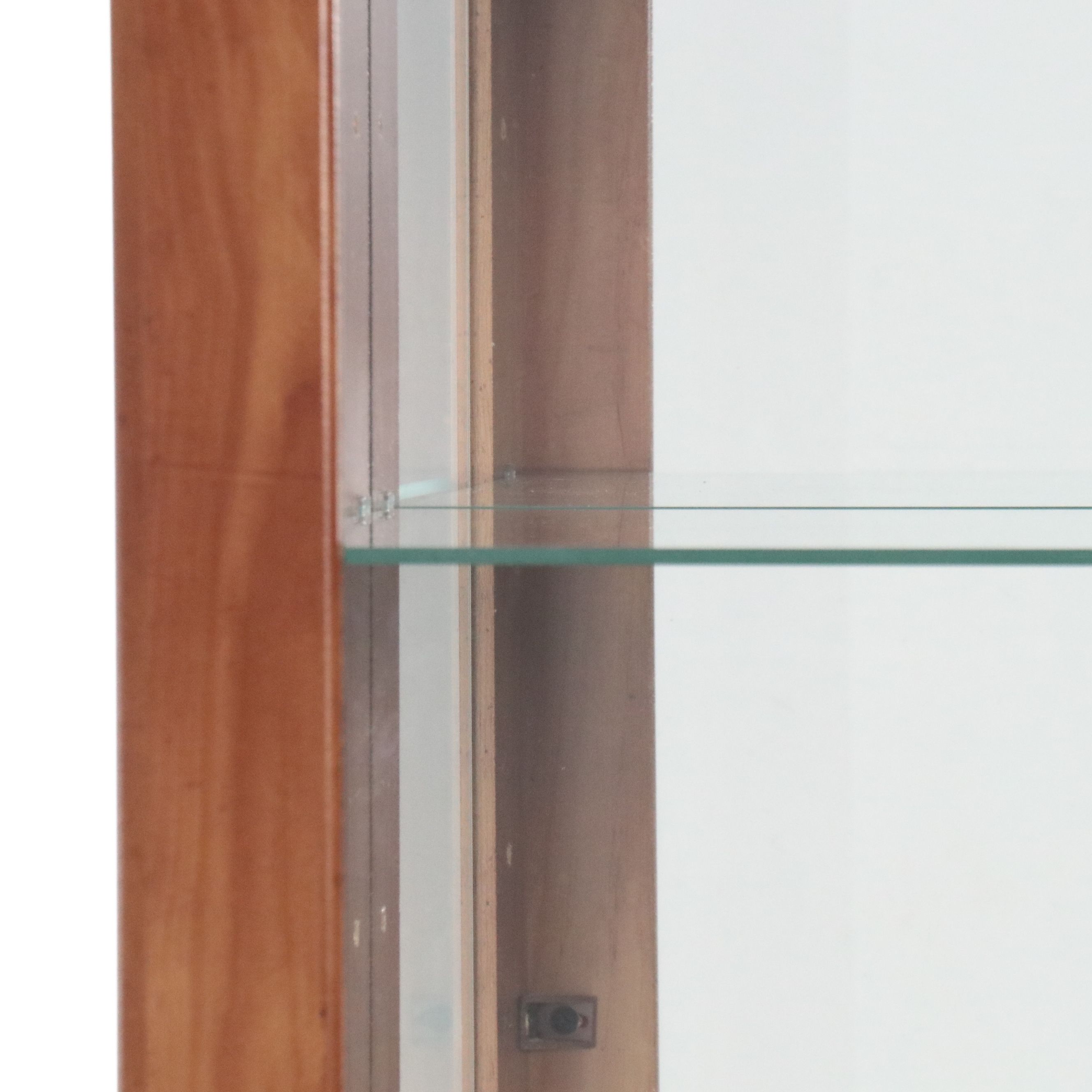 Illuminated Pine Curio Cabinet with Scrolled Metal Accent