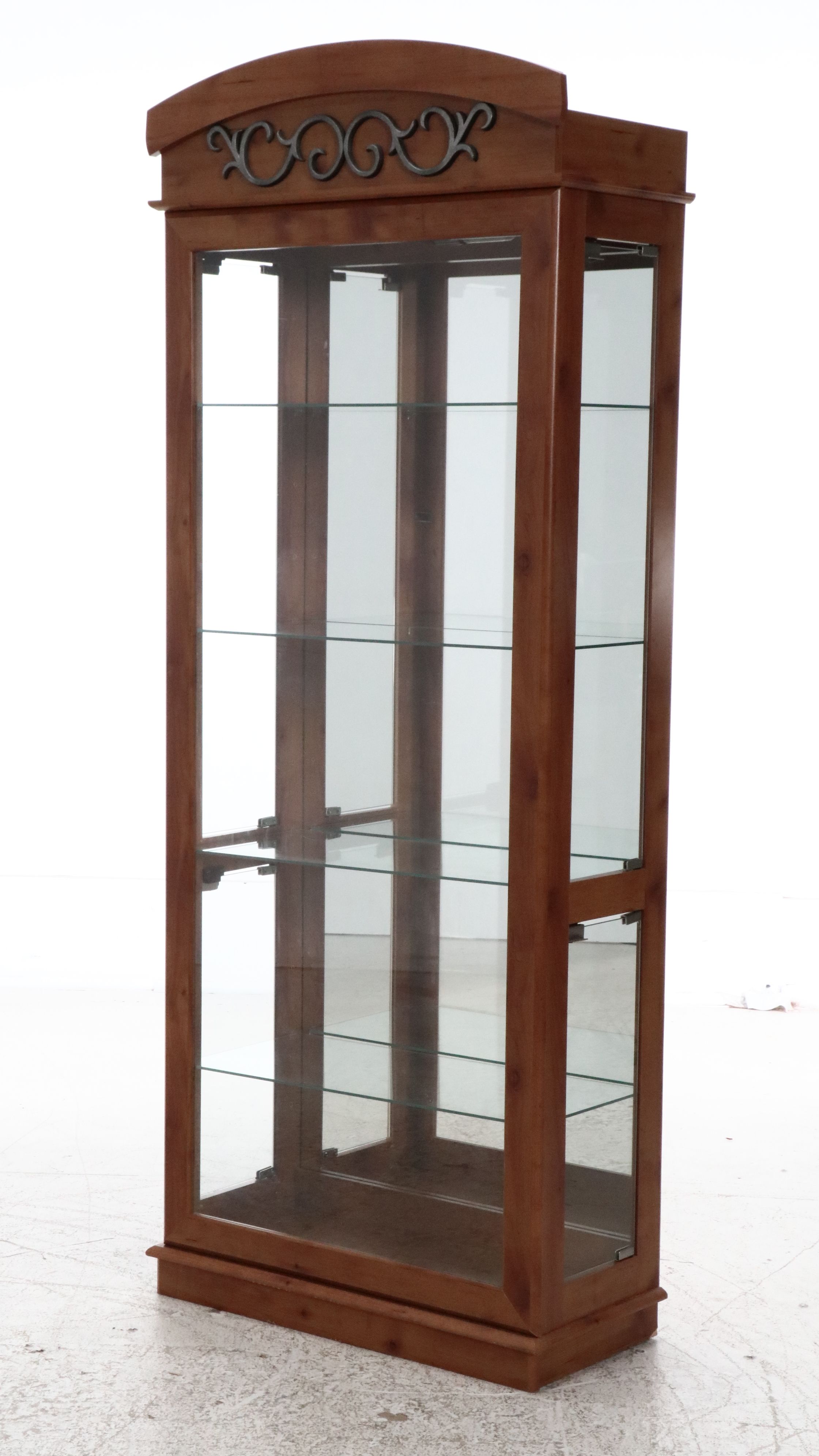 Illuminated Pine Curio Cabinet with Scrolled Metal Accent