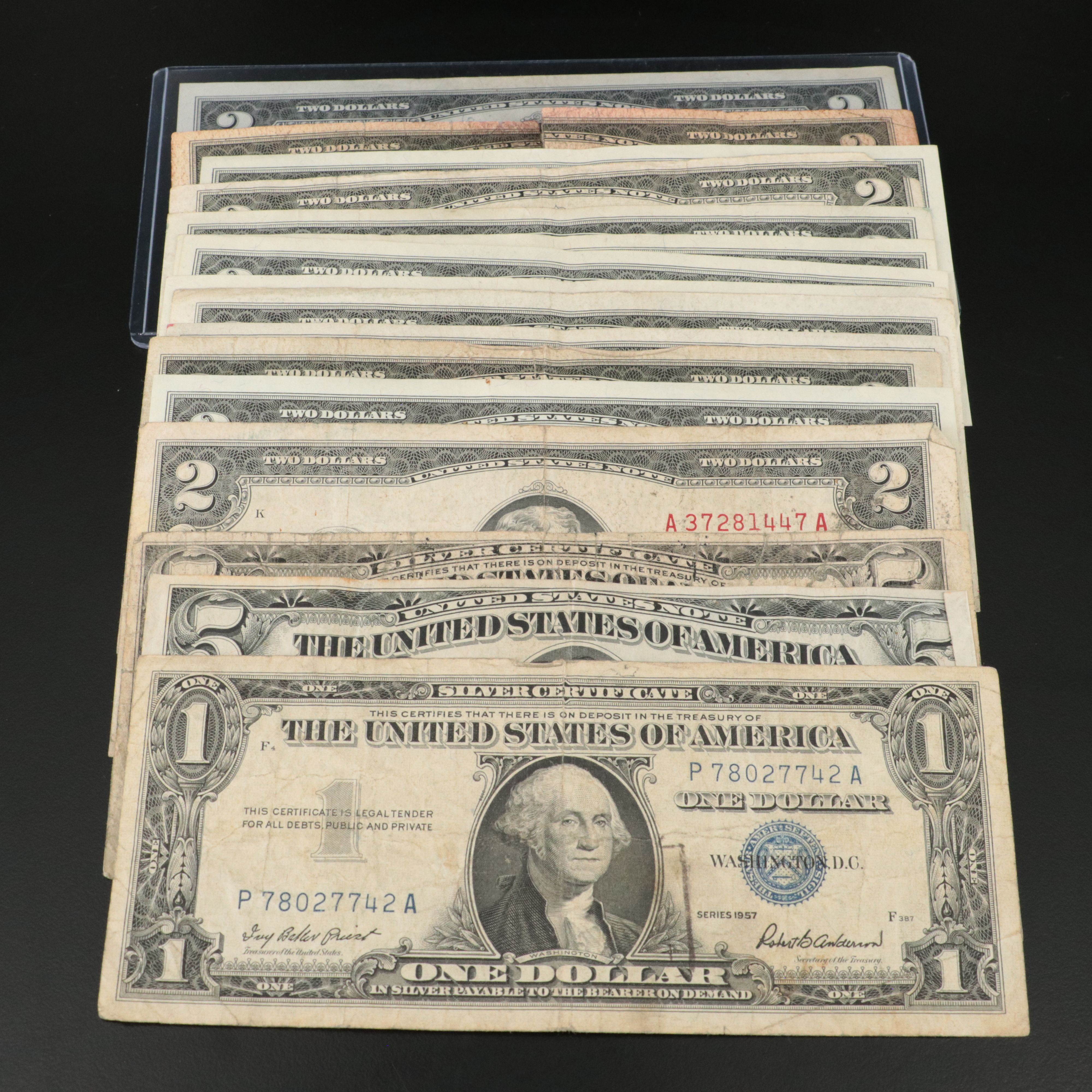 Sixteen U.S. Currency Notes with Writing on Them