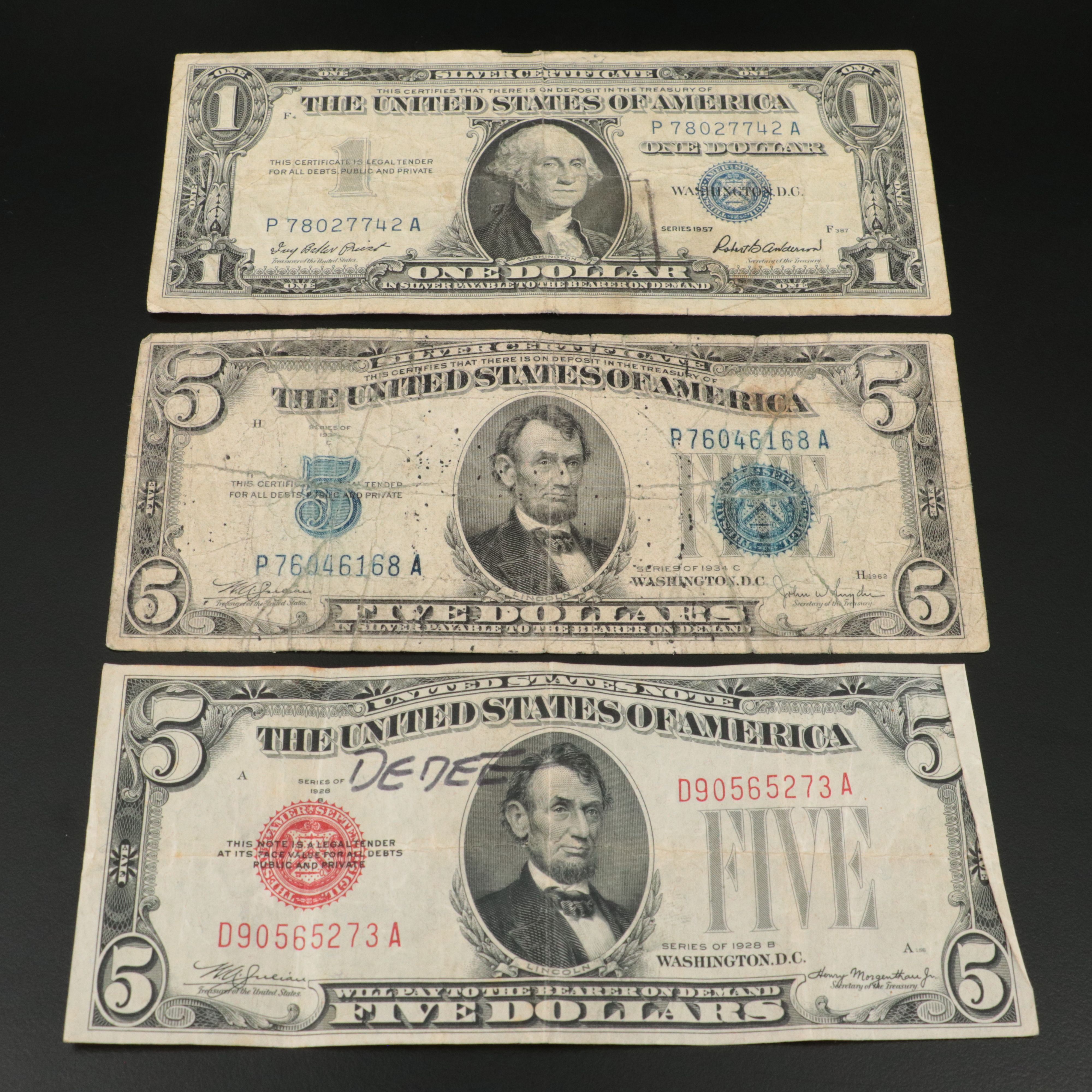 Sixteen U.S. Currency Notes with Writing on Them