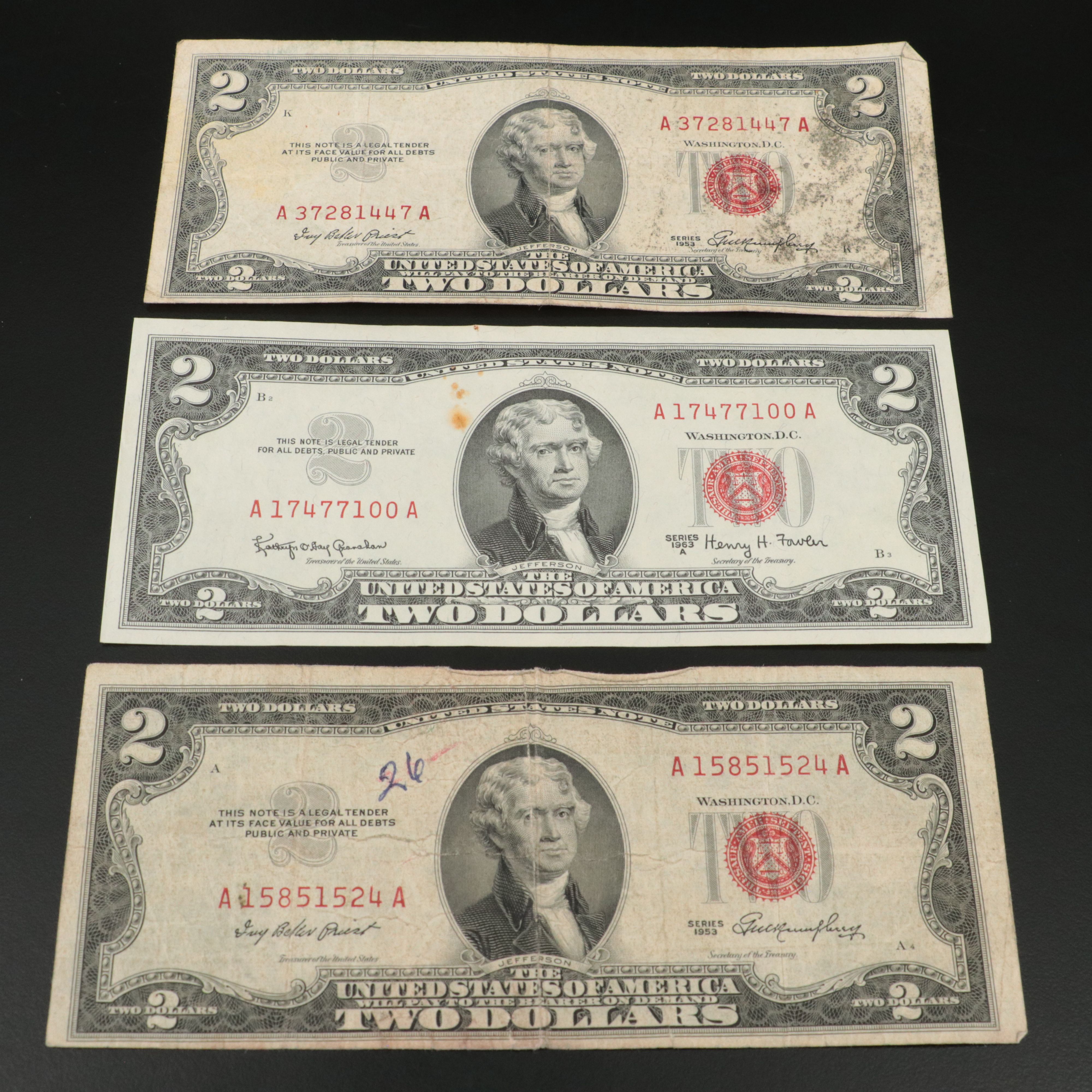 Sixteen U.S. Currency Notes with Writing on Them